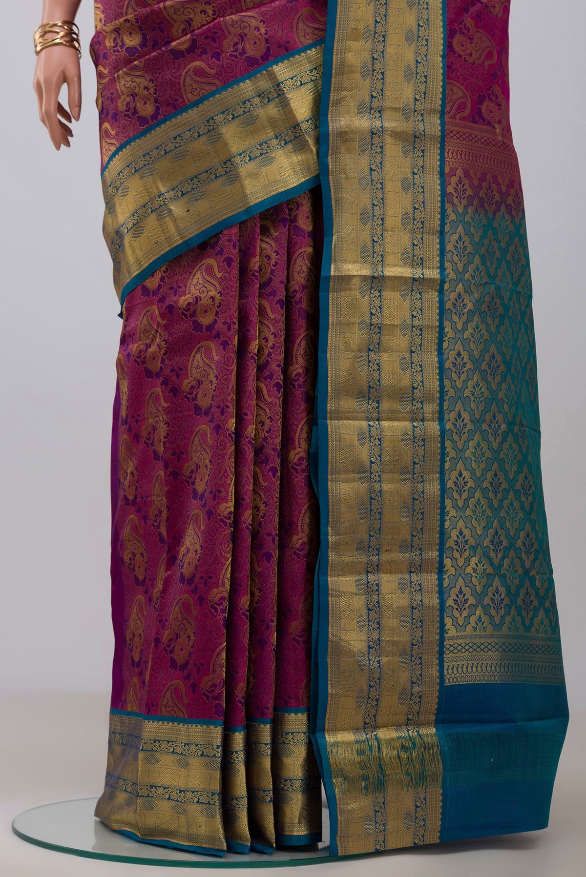 Pleats and pallu of Purple Kanchipuram Saree with Zari Brocade on the body and Zari Border. 