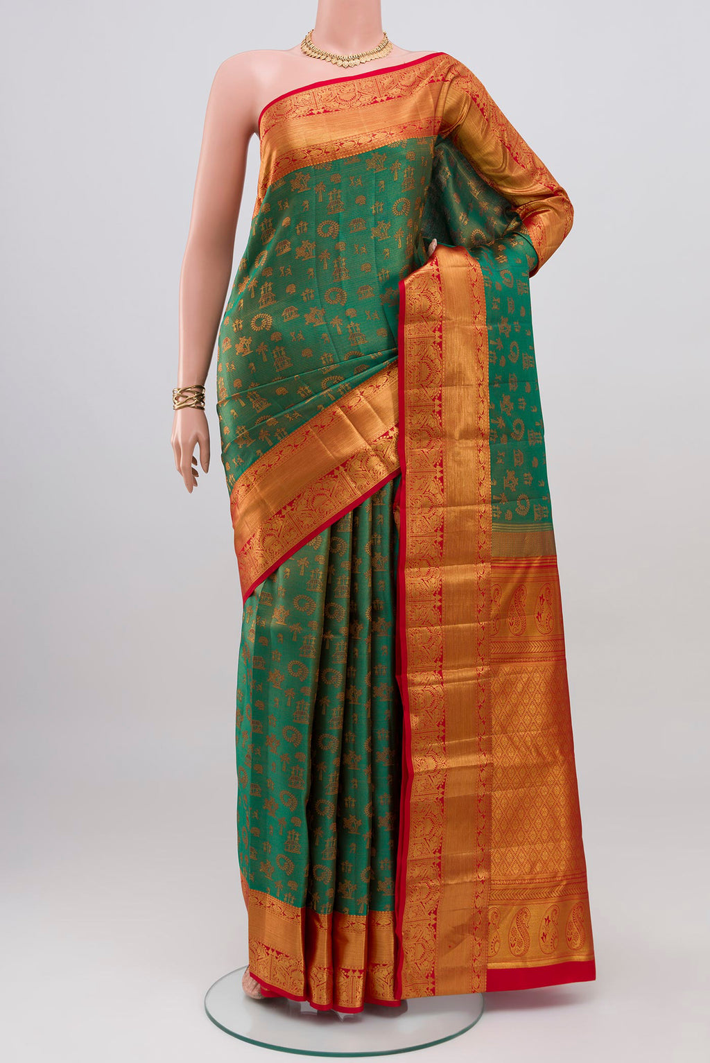 Green Kanchipuram Silk Saree with Jacquard design on the body and Zari Border.  displayed on a mannequin