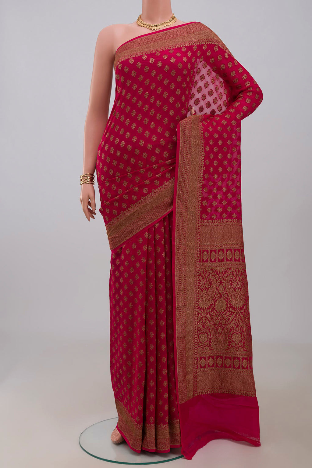 Pink Georgette Saree with Fancy on the body and Fancy Border.  displayed on a mannequin