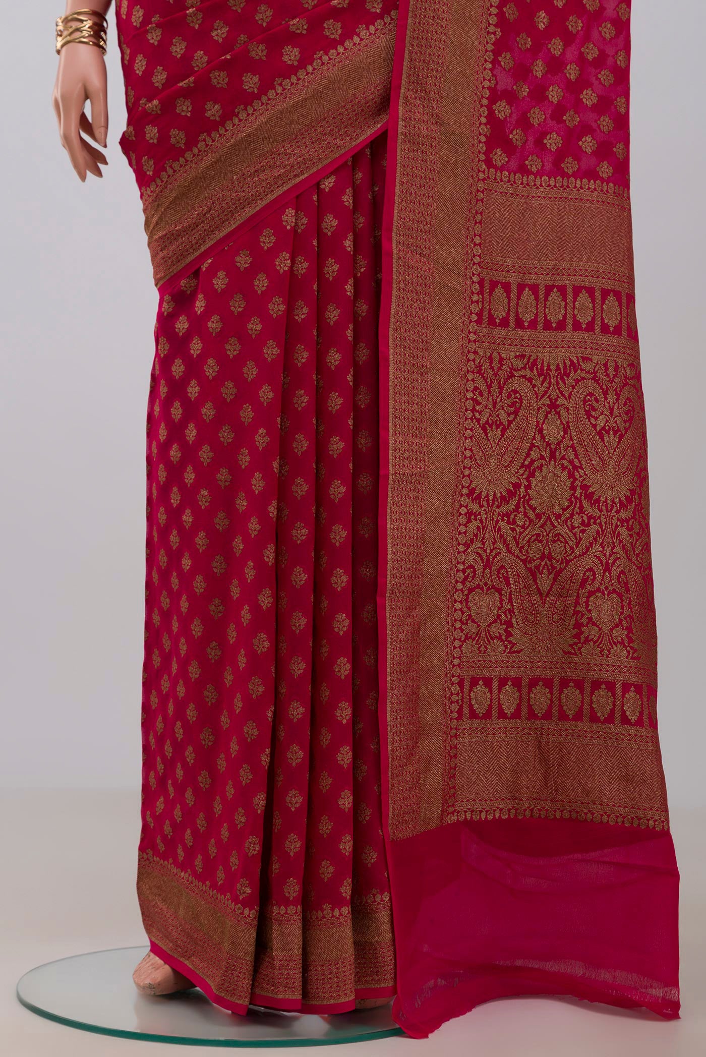 Pleats and pallu of Pink Georgette Saree with Fancy on the body and Fancy Border. 