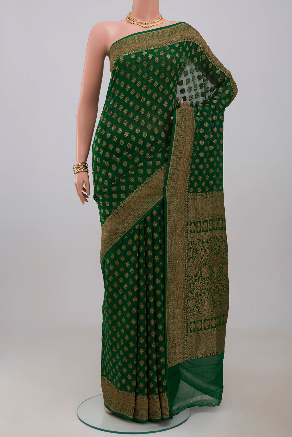 Green Georgette Saree with Fancy on the body and Fancy Border.  displayed on a mannequin