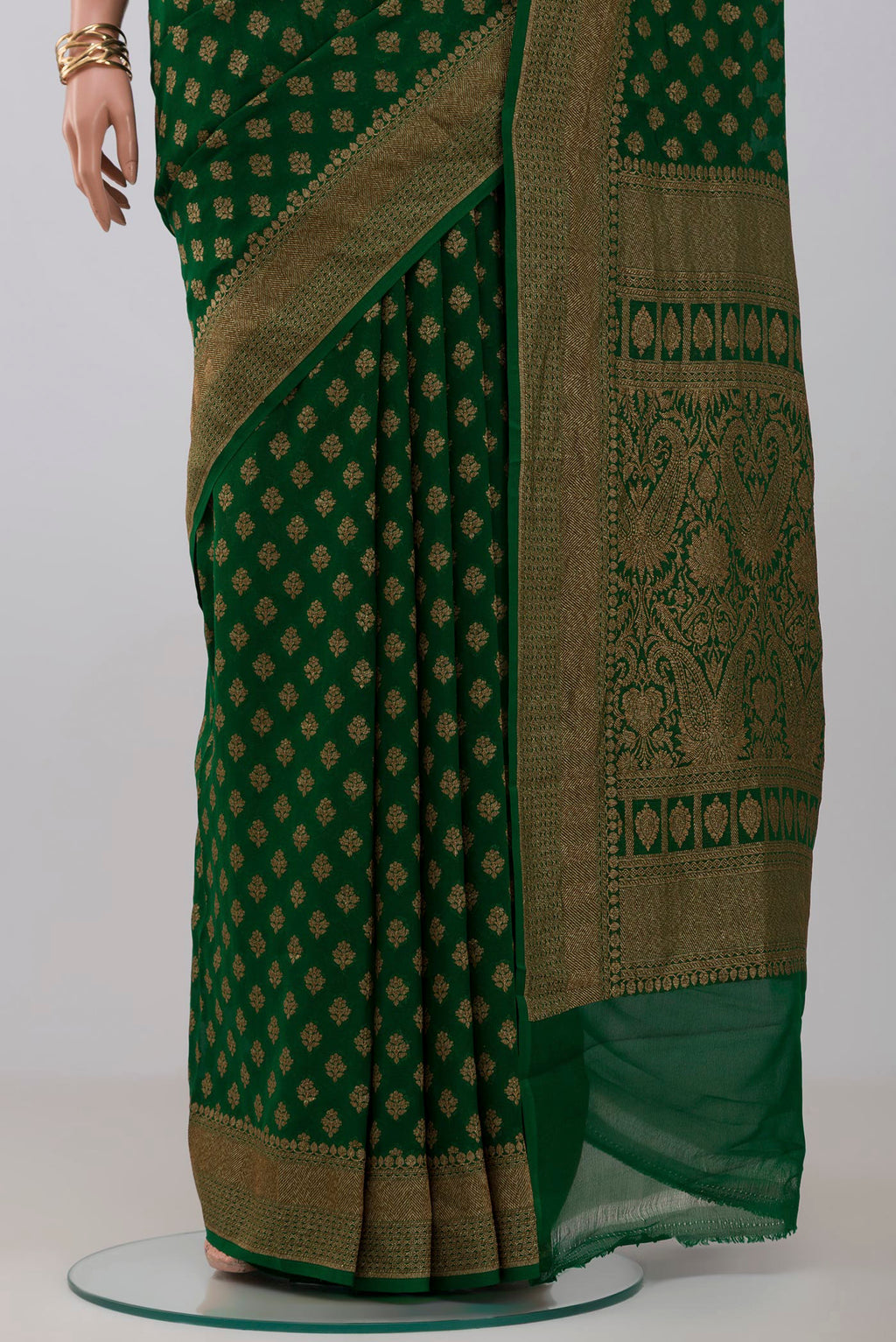 Pleats and pallu of Green Georgette Saree with Fancy on the body and Fancy Border. 
