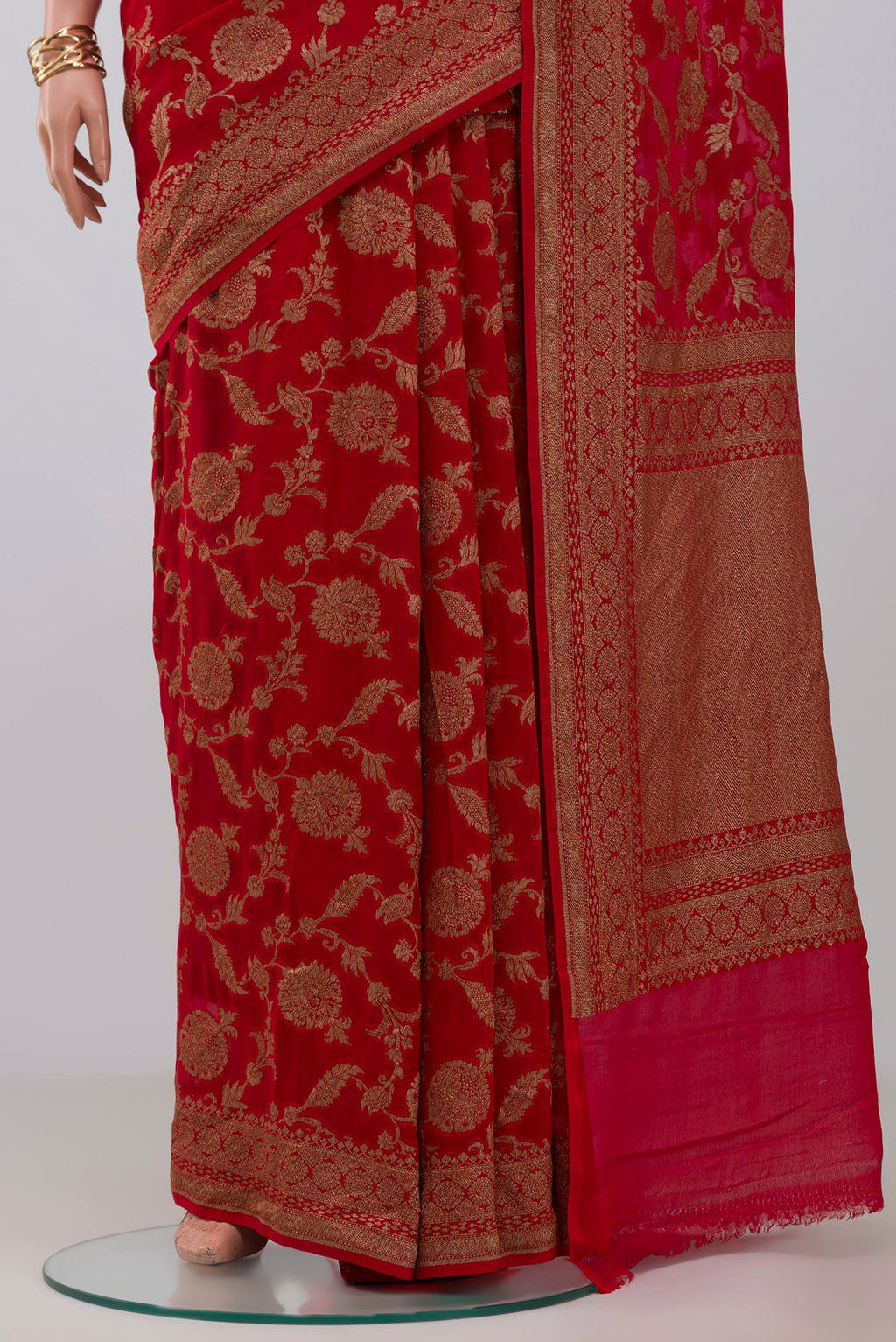 Pleats and pallu of Red Georgette Saree with Fancy on the body and Fancy Border. 