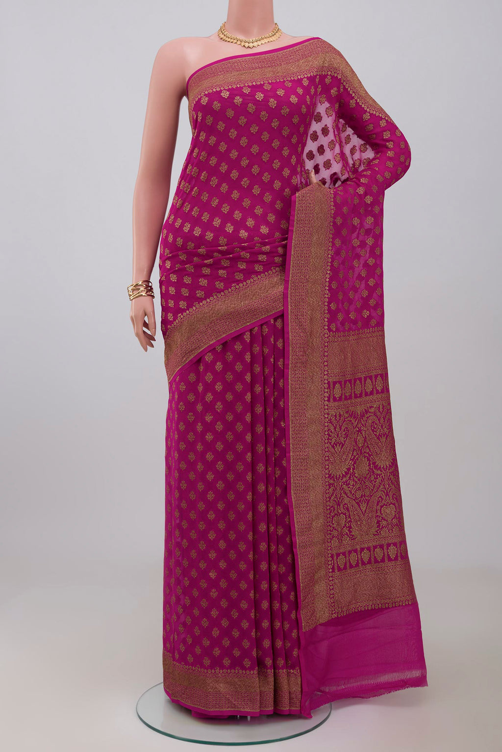 Pink Georgette Saree with Fancy on the body and Fancy Border.  displayed on a mannequin