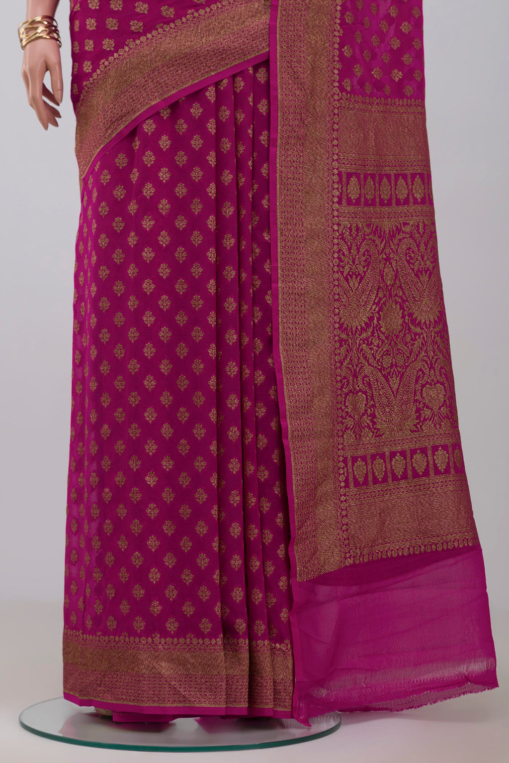 Pleats and pallu of Pink Georgette Saree with Fancy on the body and Fancy Border. 