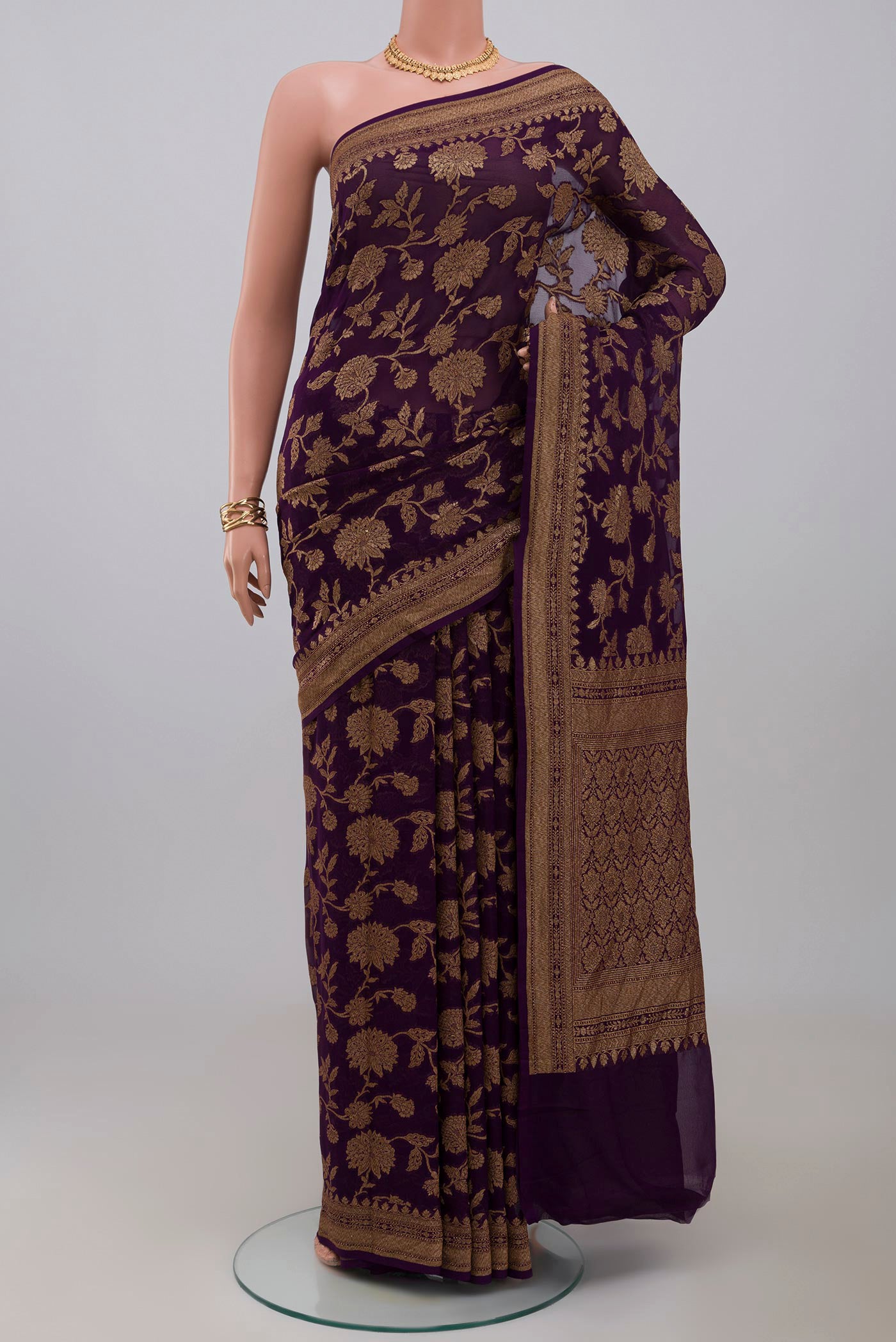 Purple Georgette Saree with Fancy on the body and Fancy Border.  displayed on a mannequin