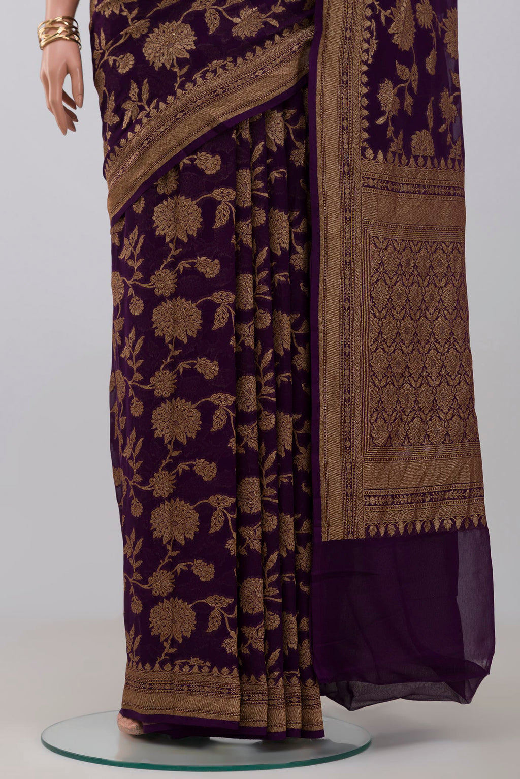 Pleats and pallu of Purple Georgette Saree with Fancy on the body and Fancy Border. 
