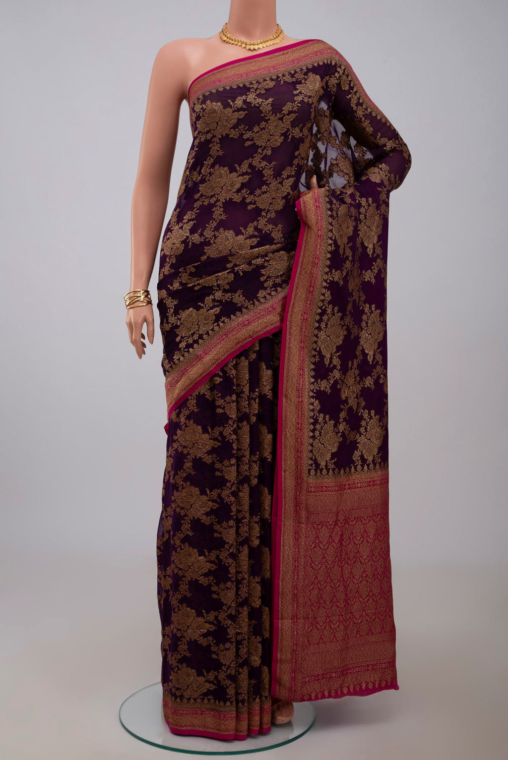 Purple Georgette Saree with Fancy on the body and Zari Border.  displayed on a mannequin
