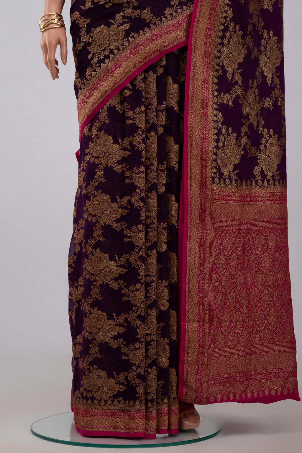 Pleats and pallu of Purple Georgette Saree with Fancy on the body and Zari Border. 