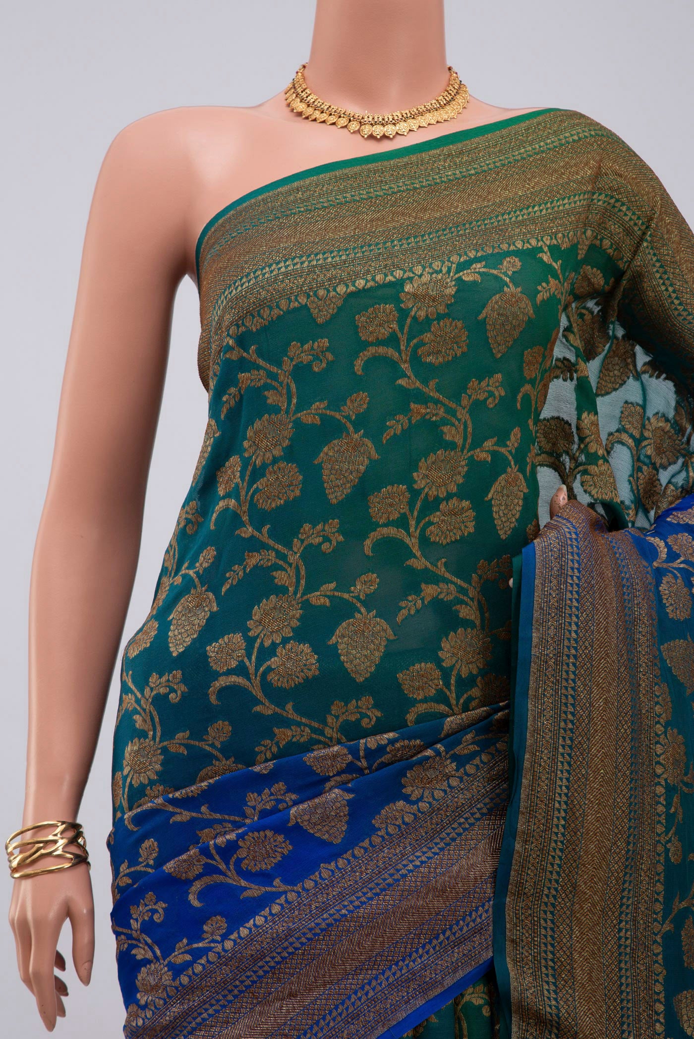 Border image of Green Georgette Saree with Fancy on the body and Zari Border. 