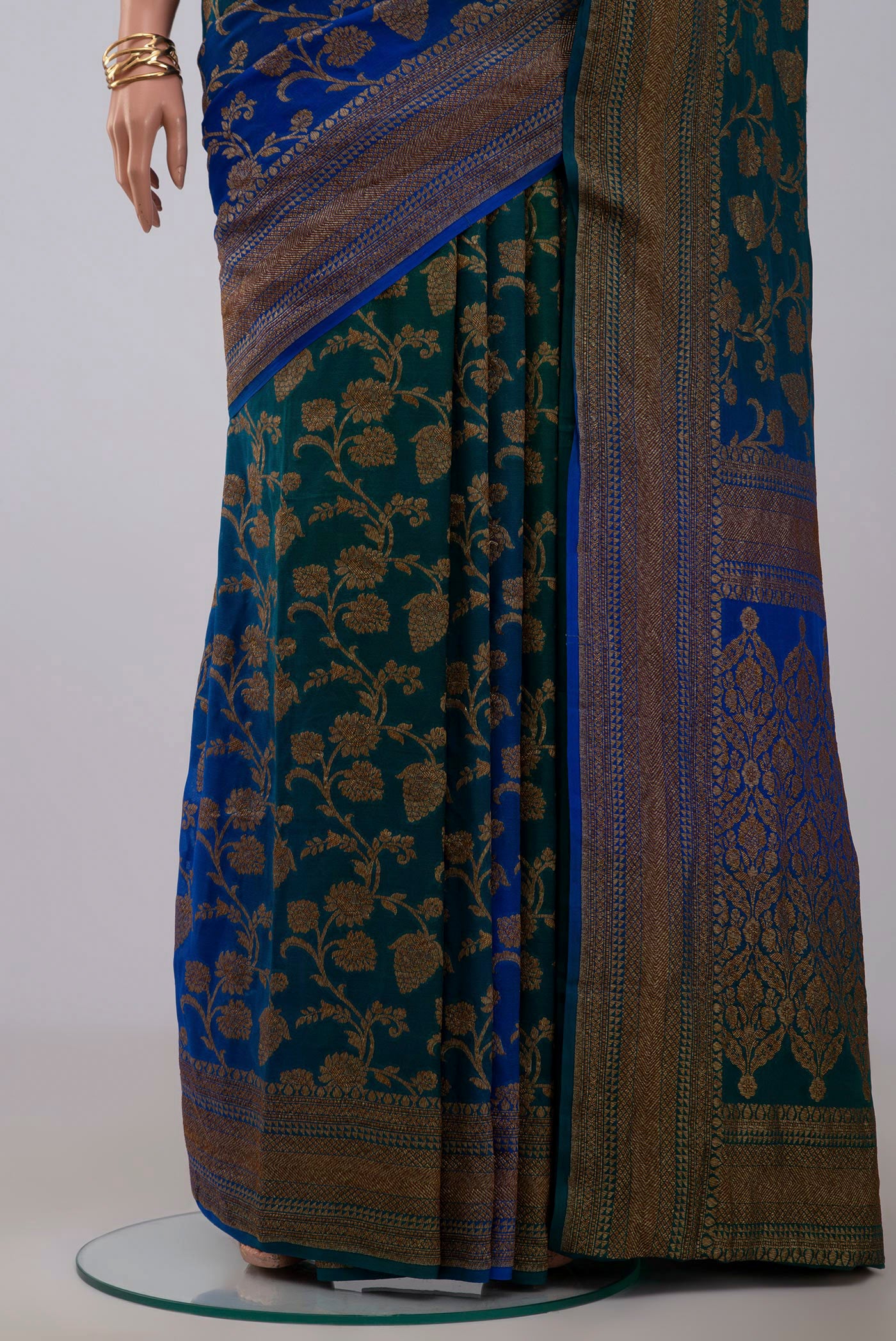 Pleats and pallu of Green Georgette Saree with Fancy on the body and Zari Border. 