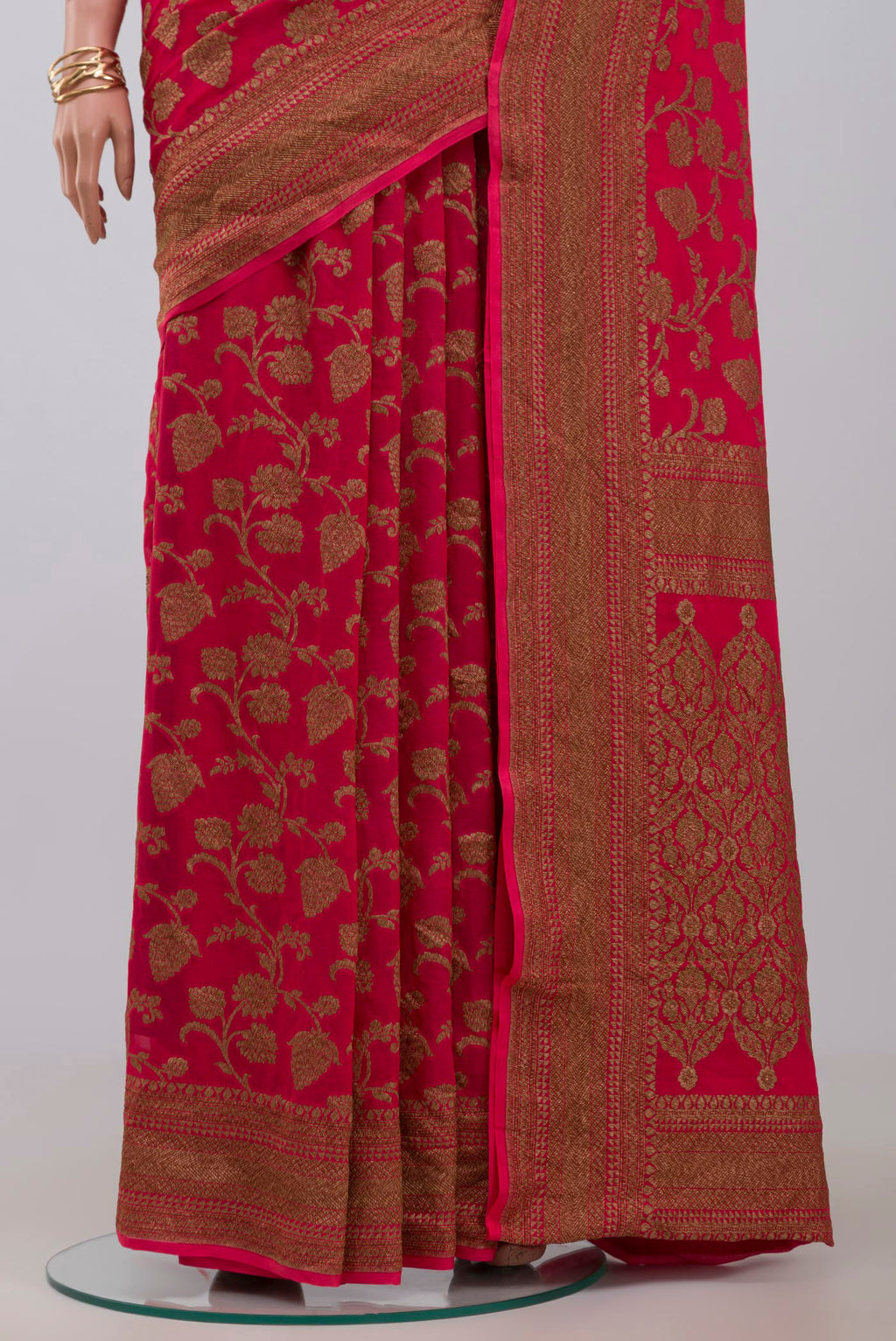 Pleats and pallu of Pink Georgette Saree with Fancy on the body and Zari Border. 