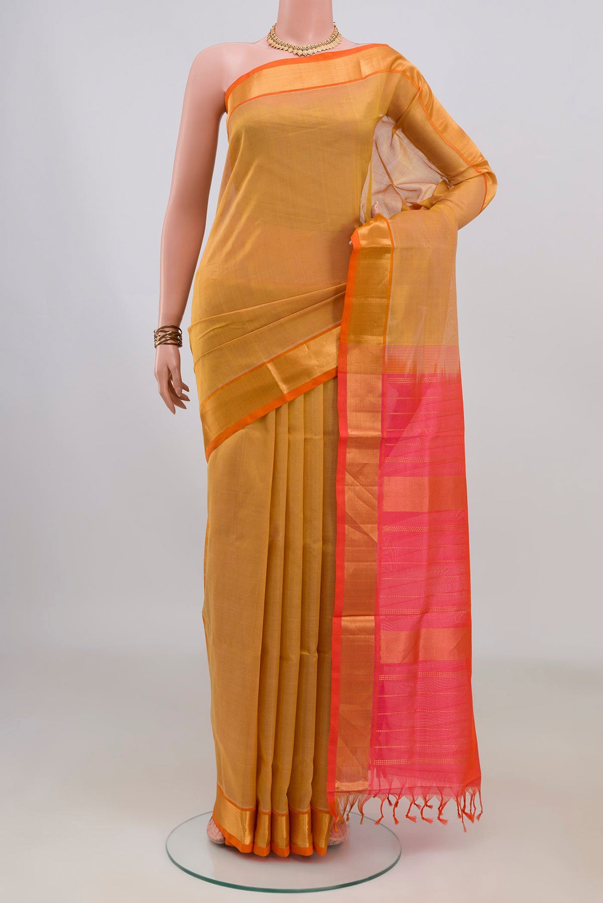 Yellow Silk Cotton Saree with Plain Body and Zari Border.  displayed on a mannequin