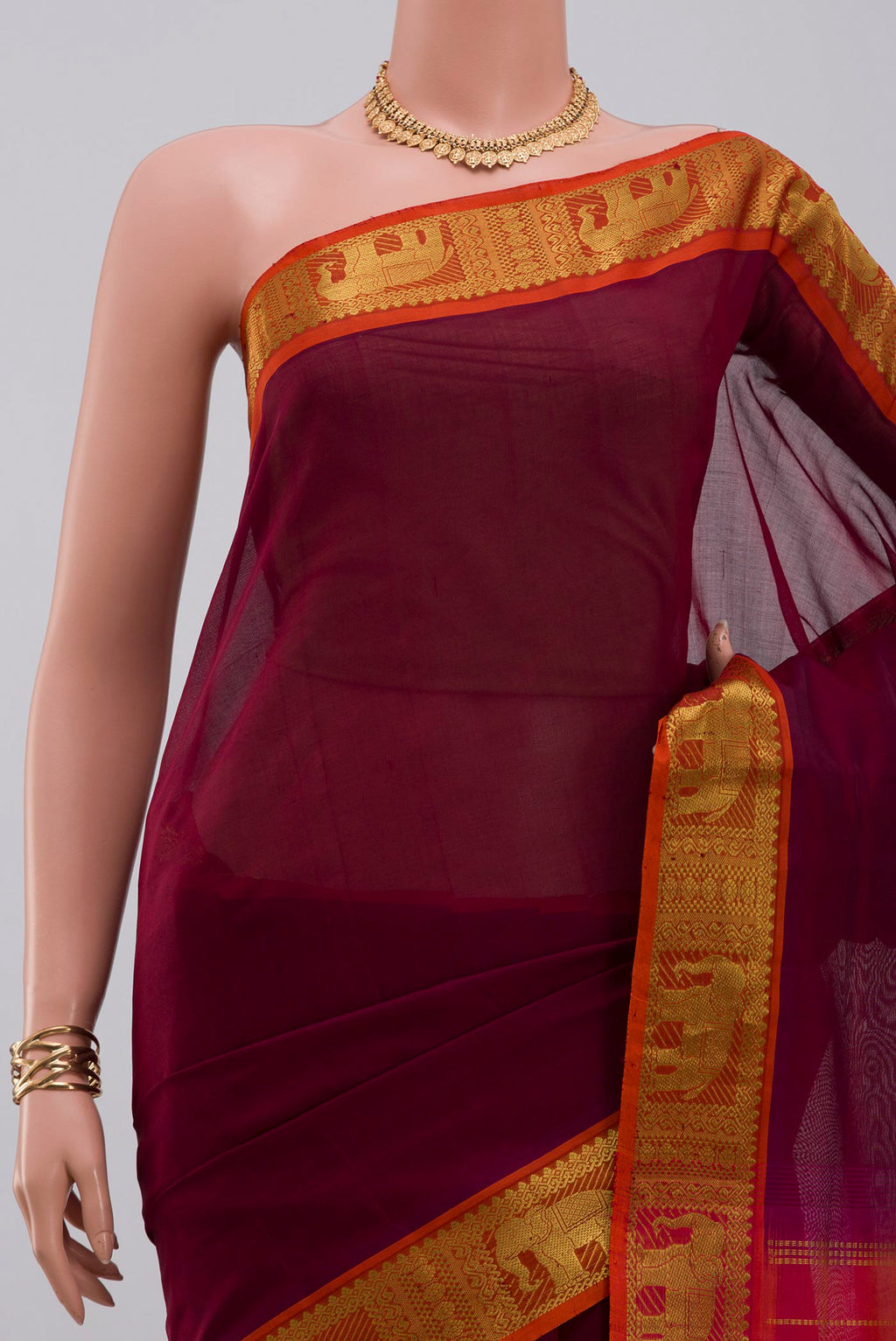 Border image of Maroon Silk Cotton Saree with Plain Body and Zari Border. 