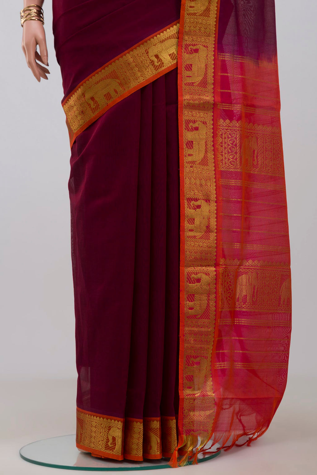 Pleats and pallu of Maroon Silk Cotton Saree with Plain Body and Zari Border. 