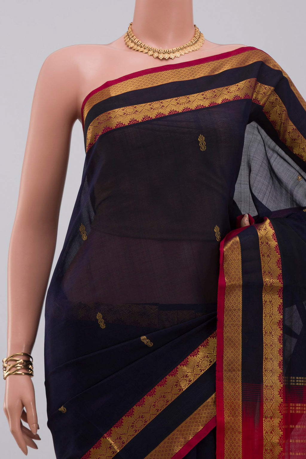 Border image of Navy Blue Silk Cotton Saree with Zari Butta on the body and Zari Border. 