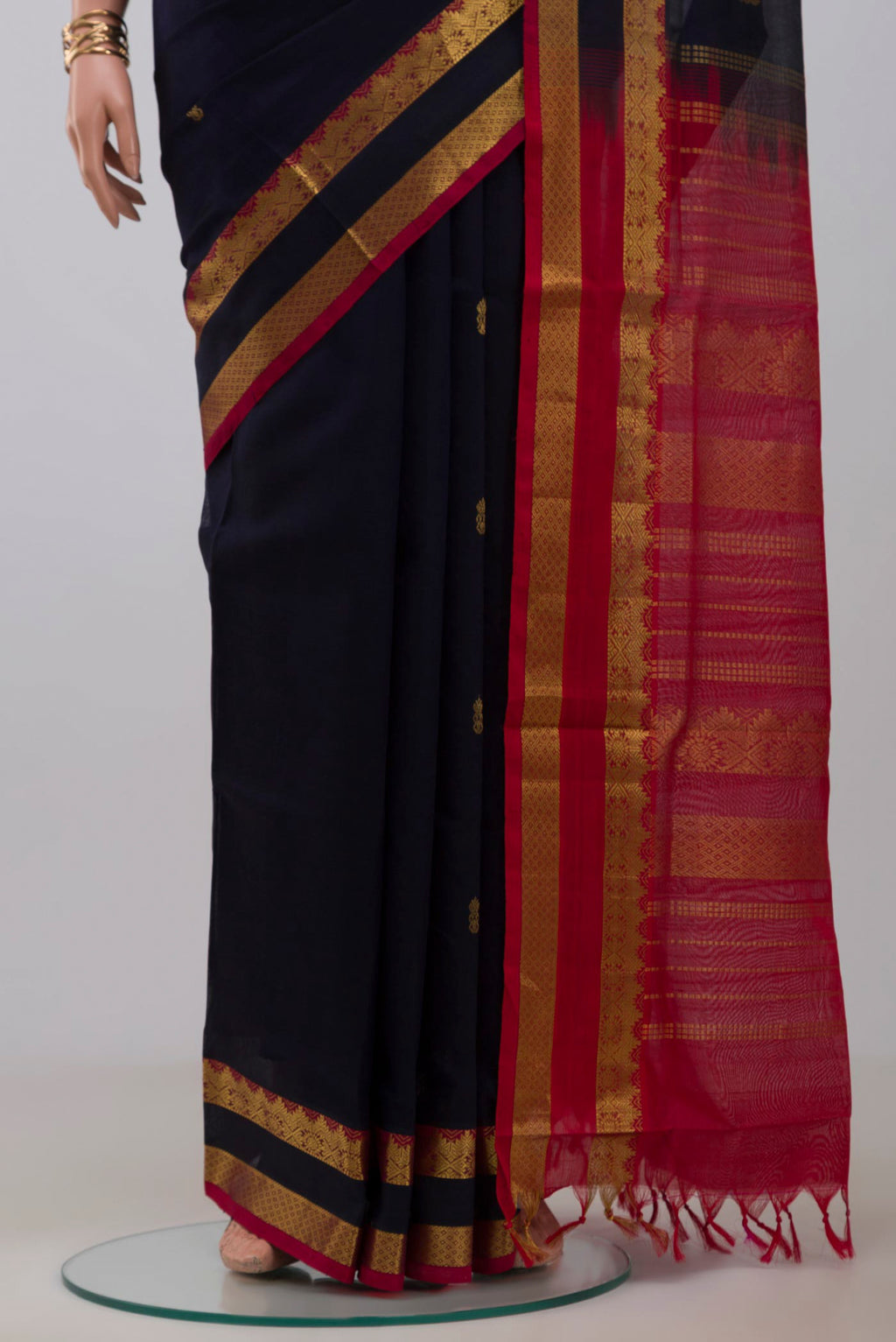 Pleats and pallu of Navy Blue Silk Cotton Saree with Zari Butta on the body and Zari Border. 