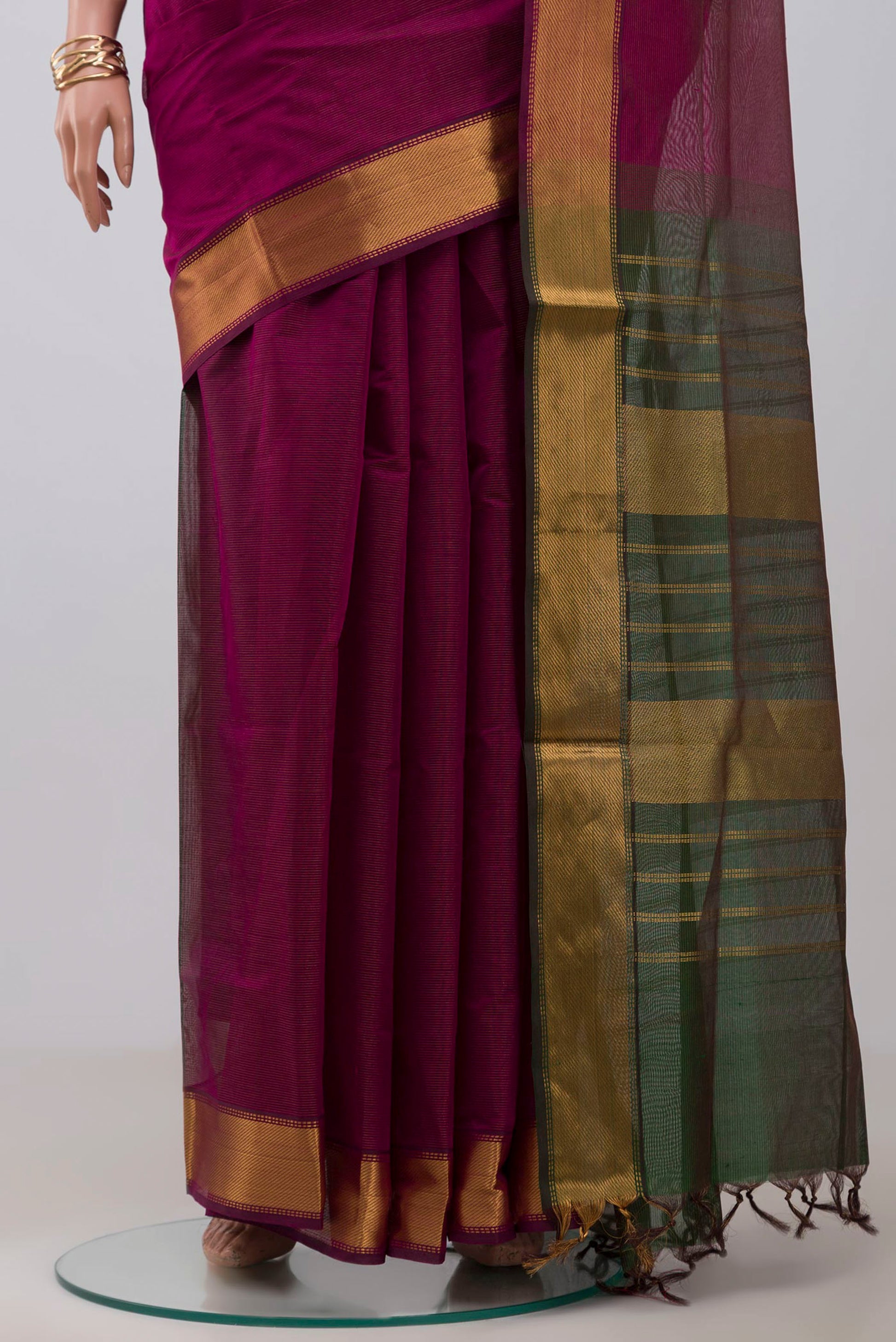Pleats and pallu of Magenta Coimbatore Silk Cotton Saree with Stripes on the body and Zari Border. 