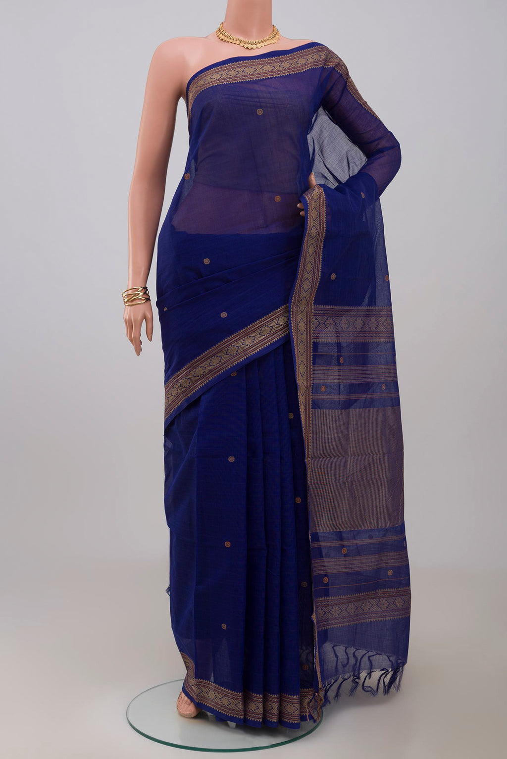 Blue Kanchi Cotton Saree with Thread Butta on the body and Thread Border.  displayed on a mannequin