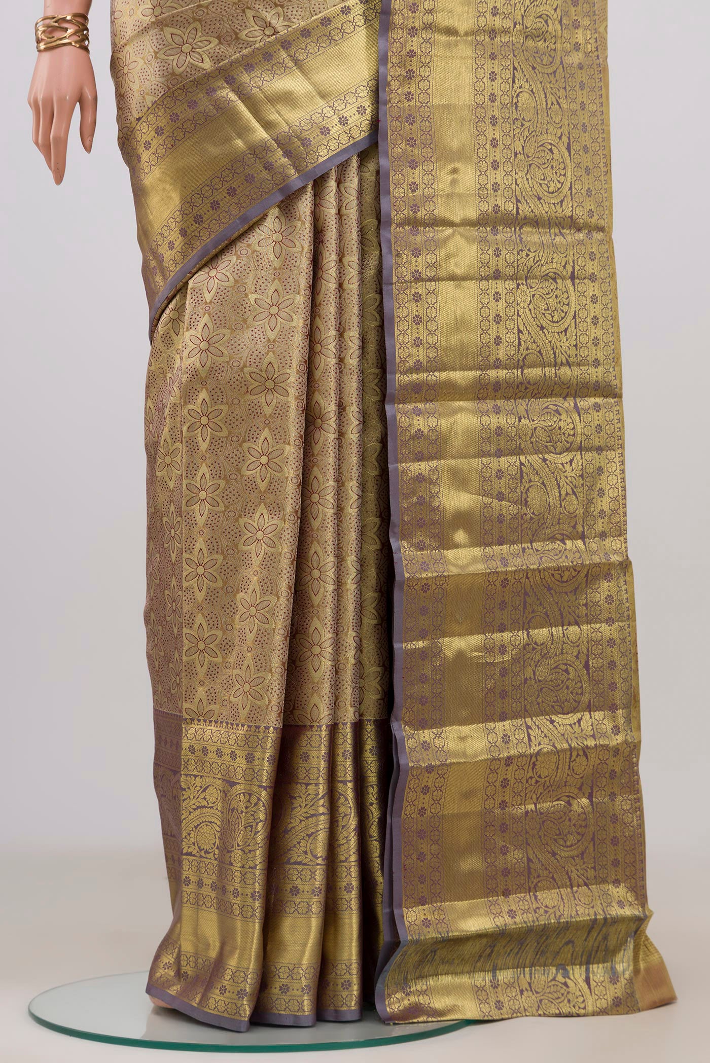 Pleats and pallu of Golden Dual Tone Kanchipuram Tissue Silk Saree with Zari Brocade on the body and Zari Border. 