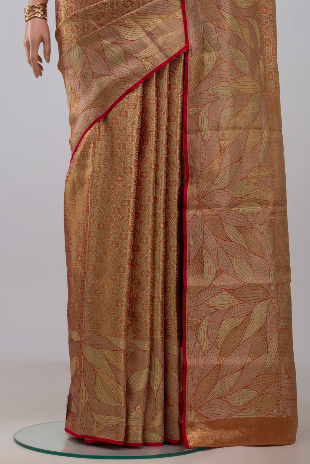 Pleats and pallu of Gold with Red Color Kanchipuram Tissue Silk Saree with Zari Brocade on the body and Fancy Border. 