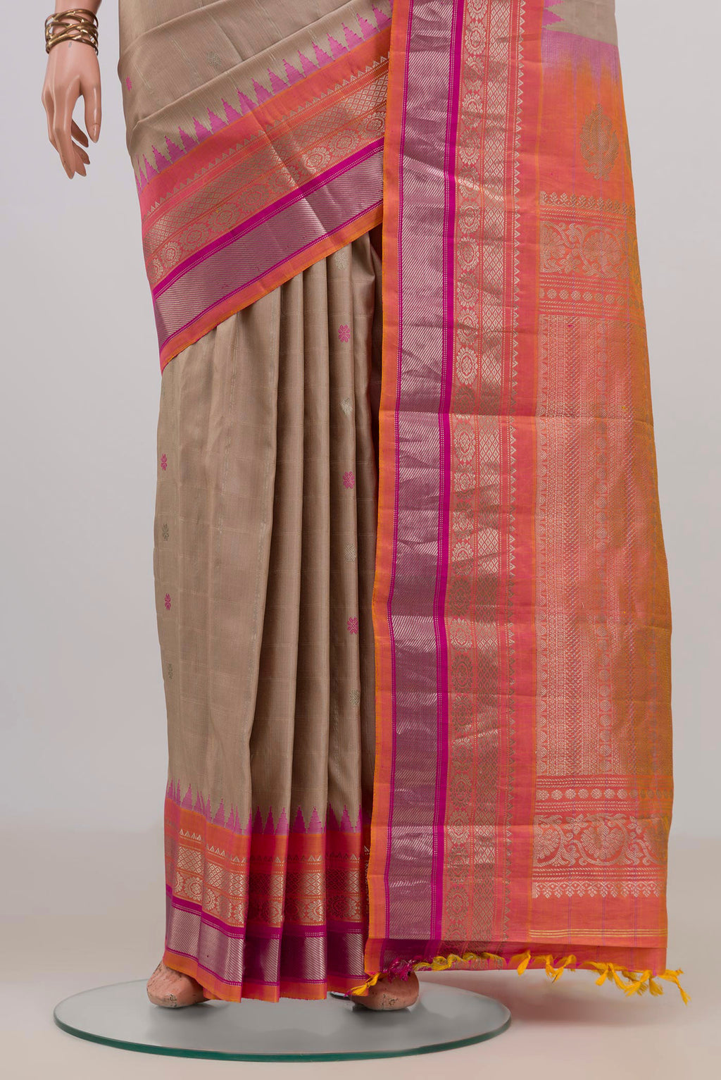 Pleats and pallu of Pure Silk Beige Gadwal Saree with Zari Butta on the body and Zari Border. 
