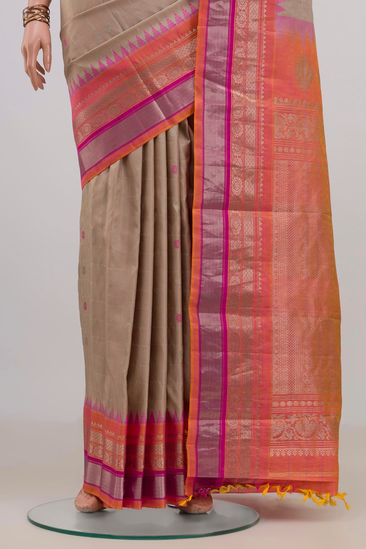 Pleats and pallu of Pure Silk Beige Gadwal Saree with Zari Butta on the body and Zari Border. 