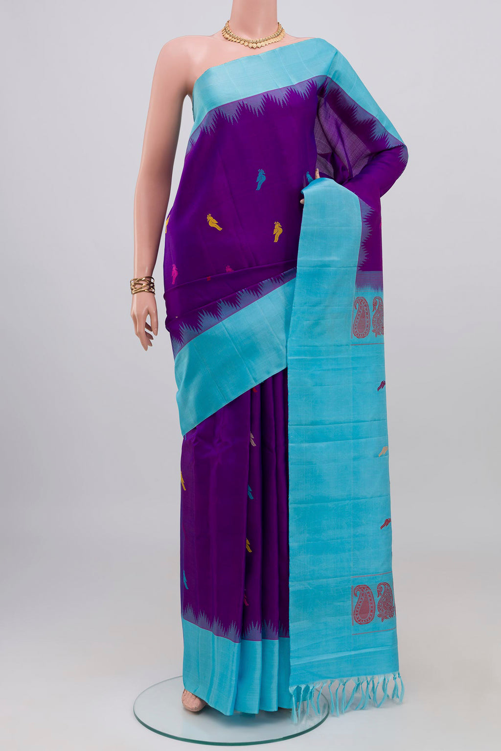 Purple Gadwal Silk Saree with Thread Butta on the body and Temple Border.  displayed on a mannequin