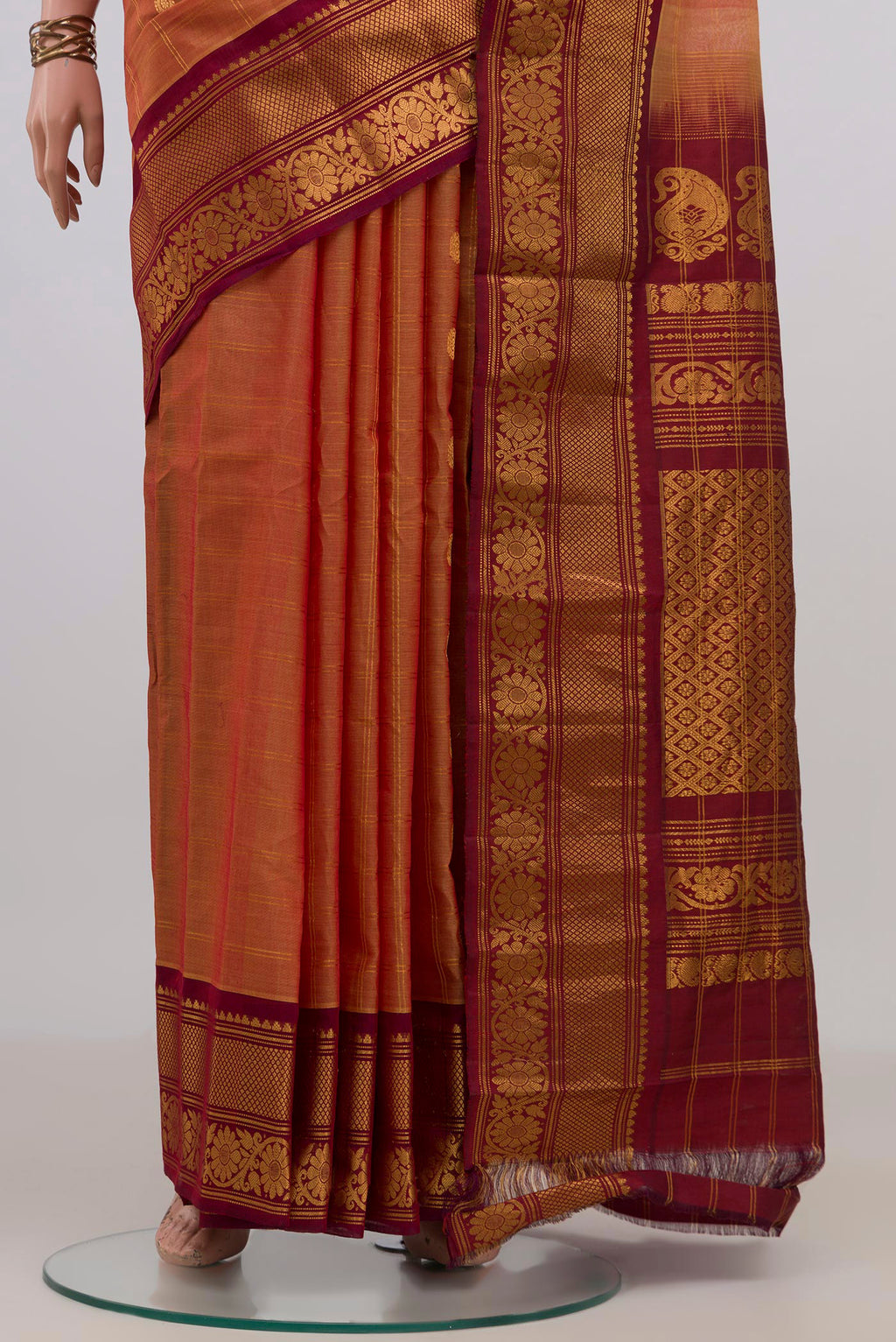 Pleats and pallu of Peach Gadwal Cotton Saree with Checked design on the body and Zari Border. 