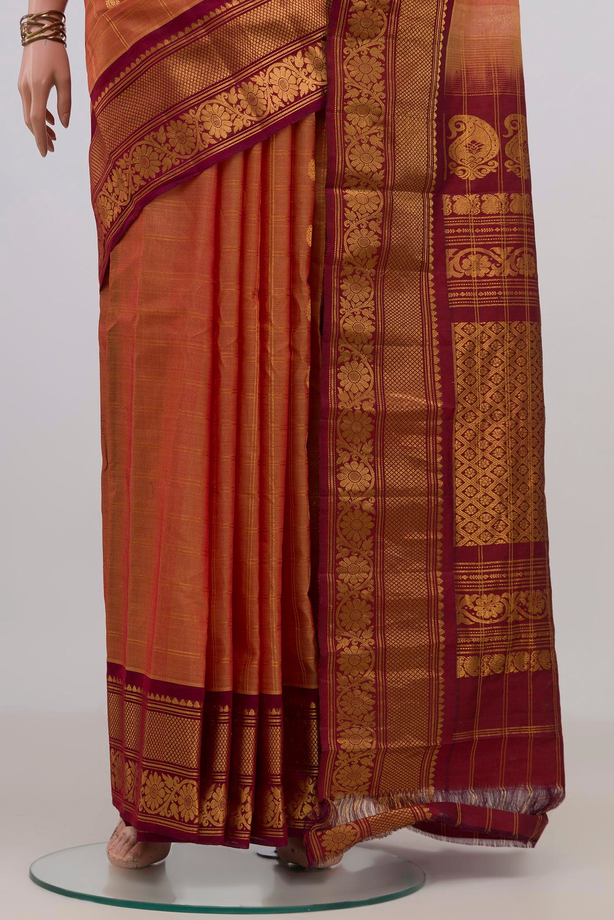 Pleats and pallu of Peach Gadwal Cotton Saree with Checked design on the body and Zari Border. 