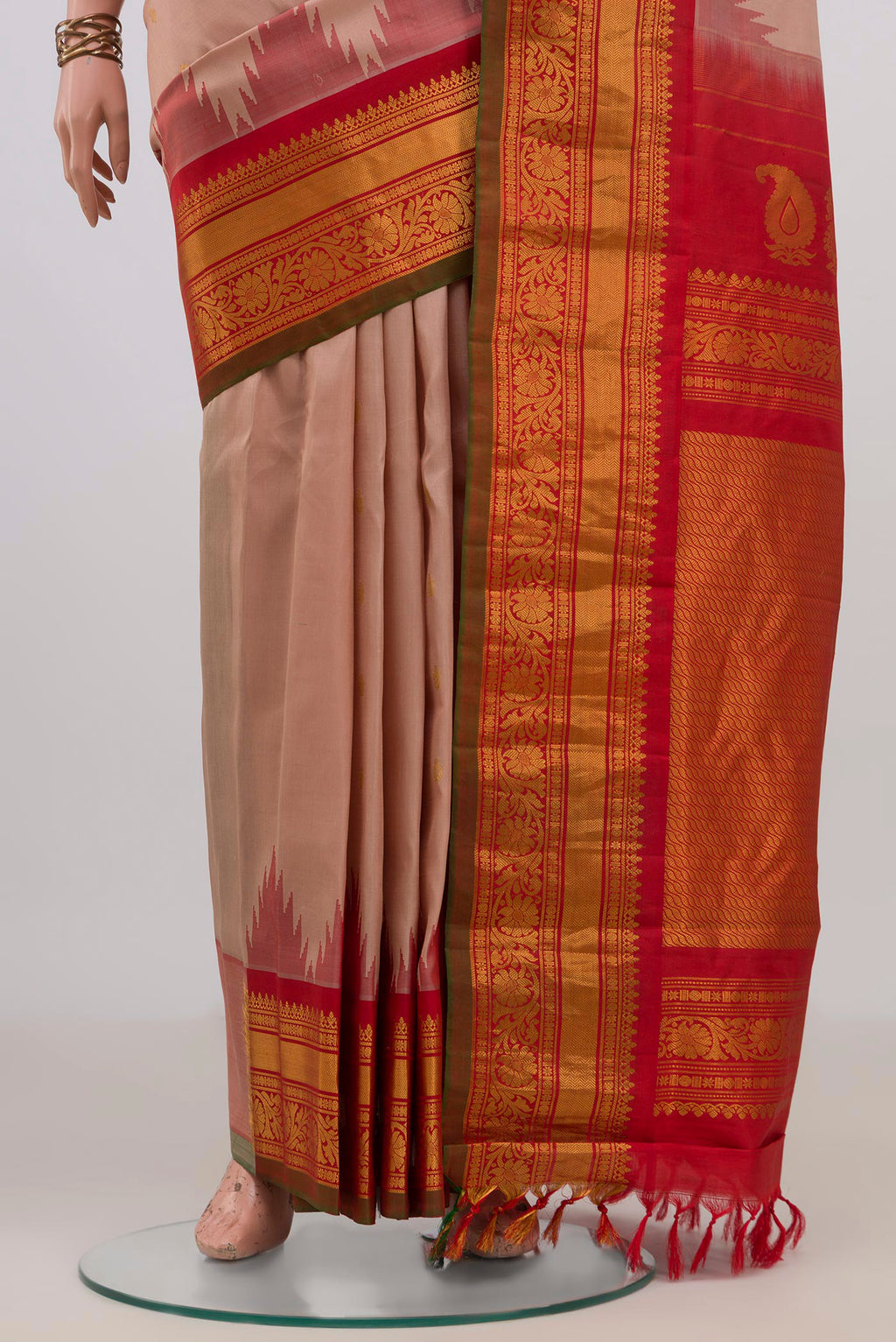 Pleats and pallu of Pure Silk Peach Gadwal Saree with Zari Butta on the body and Zari Border. 