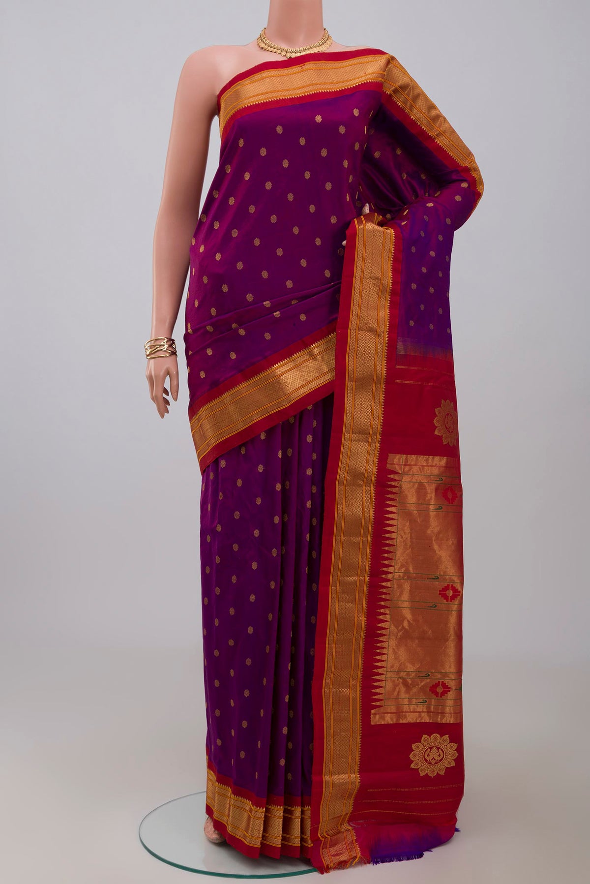 Purple Gadwal Silk Saree with Zari Butta on the body and Zari Border.  displayed on a mannequin