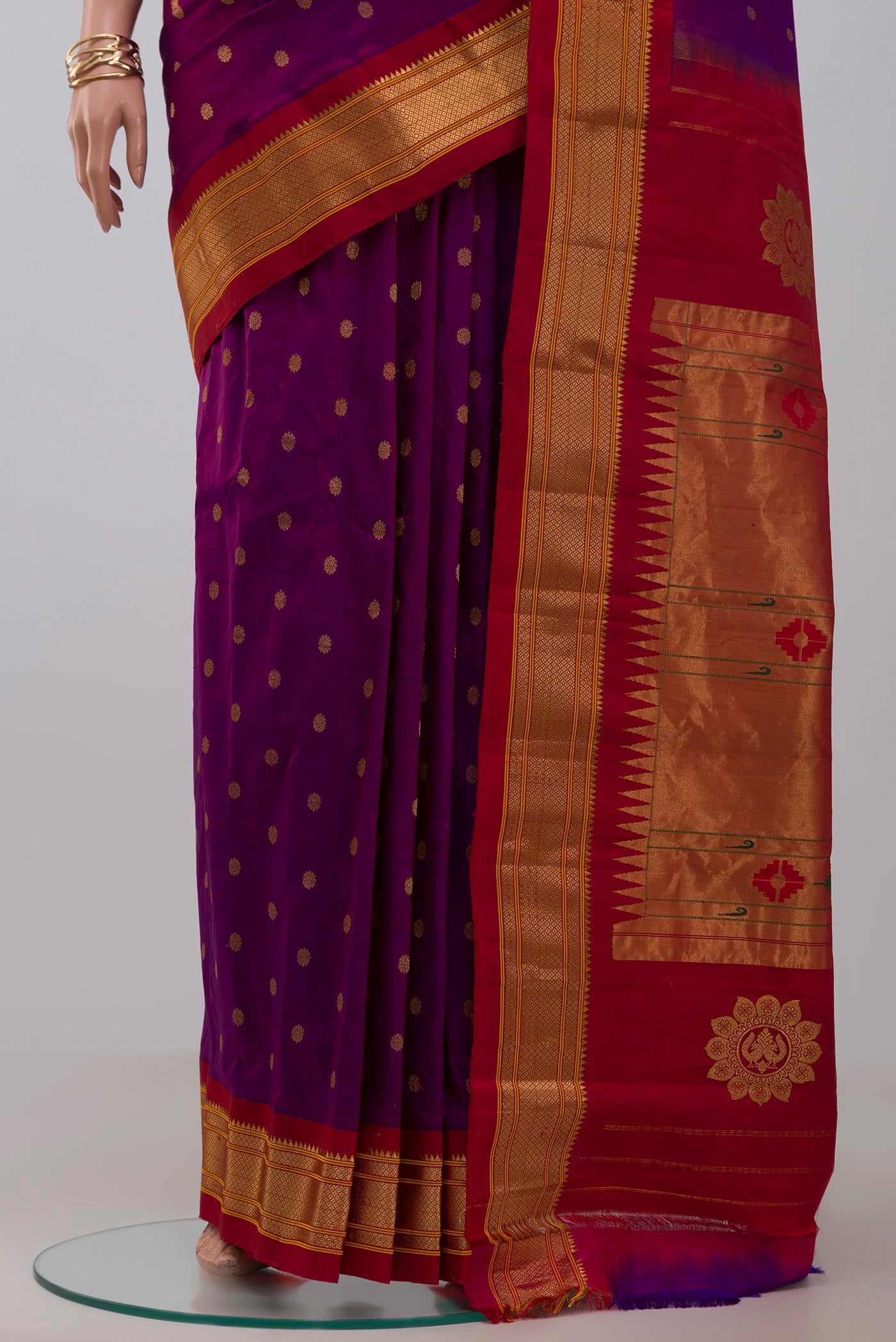 Pleats and pallu of Purple Gadwal Silk Saree with Zari Butta on the body and Zari Border. 
