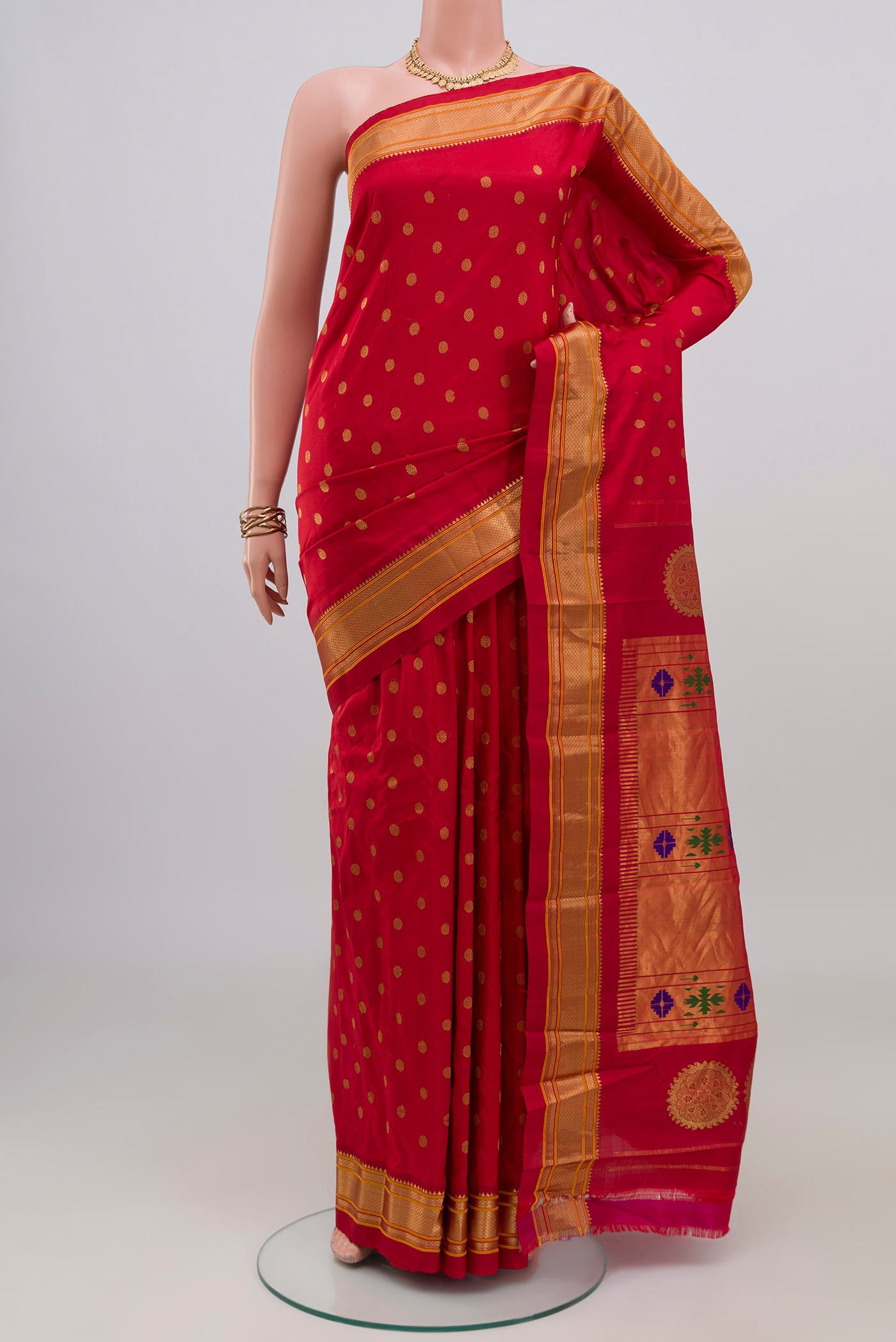 Red Gadwal Silk Saree with Zari Butta on the body and Zari Border.  displayed on a mannequin