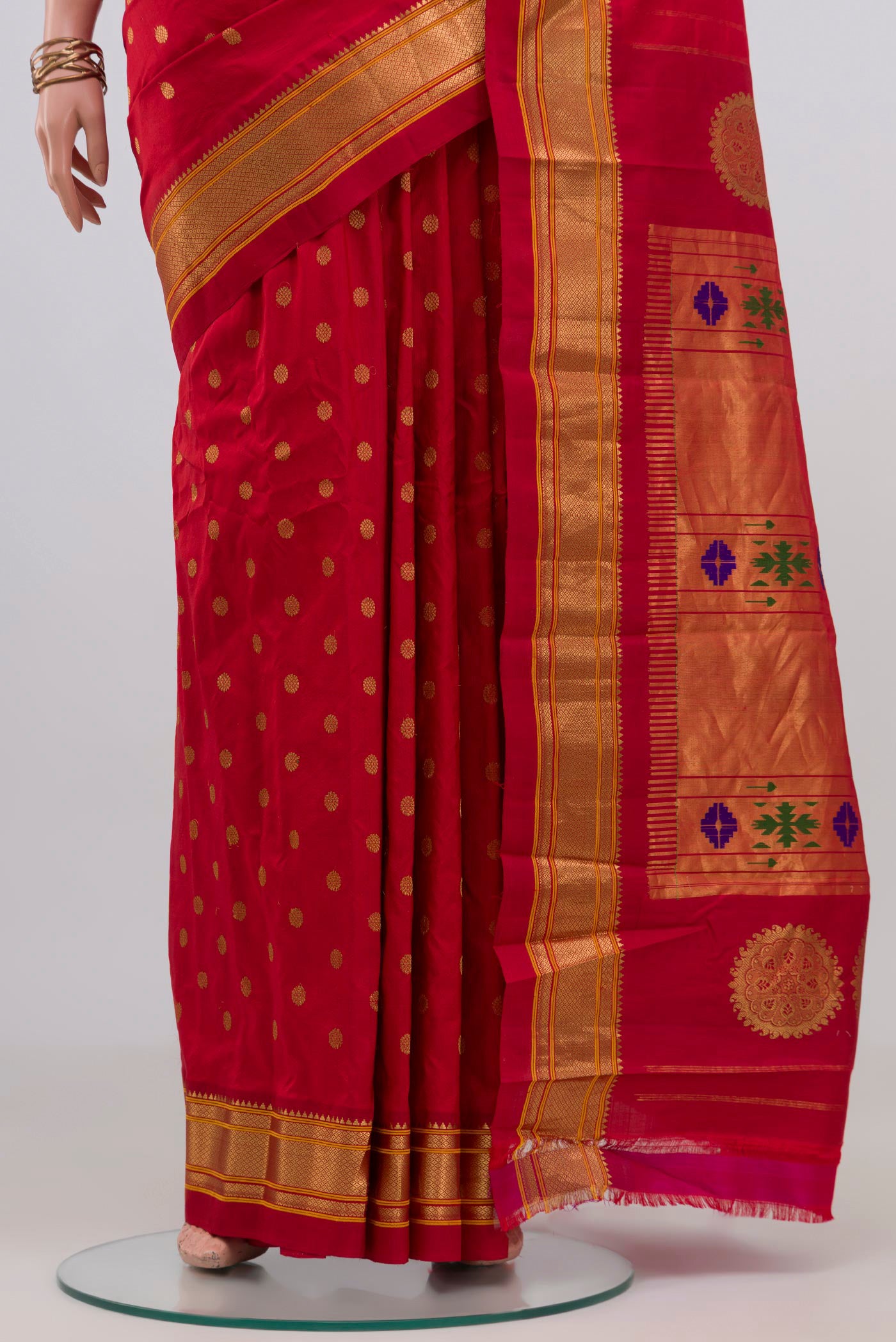 Pleats and pallu of Red Gadwal Silk Saree with Zari Butta on the body and Zari Border. 
