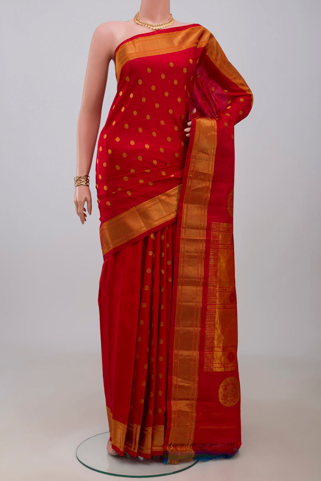 Red Gadwal Silk Saree with Zari Butta on the body and Zari Border.  displayed on a mannequin