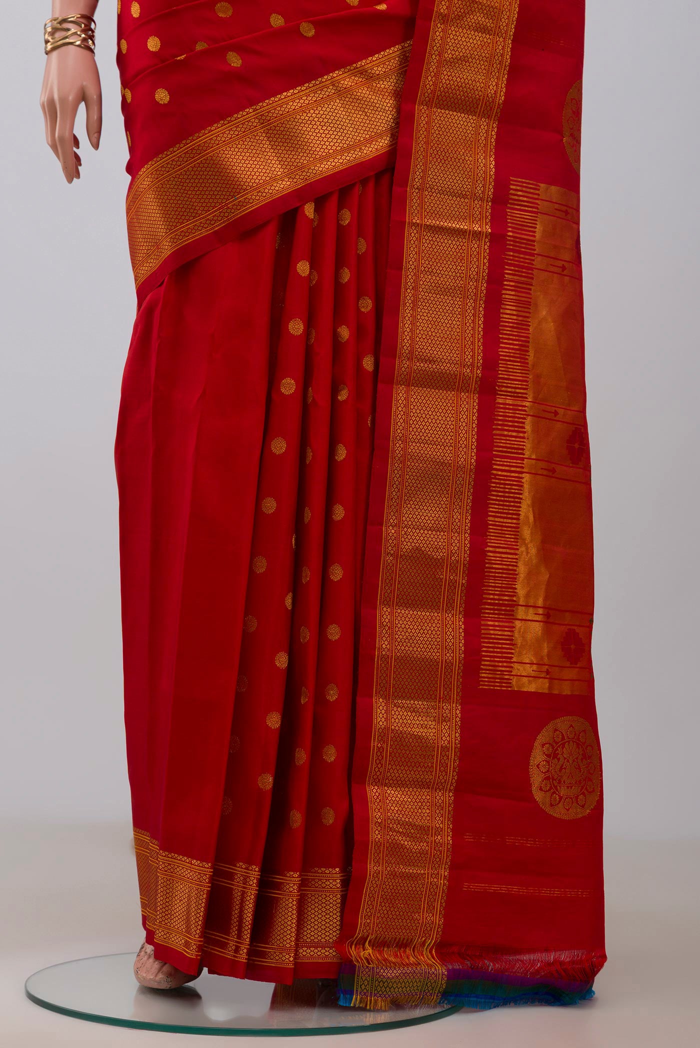 Pleats and pallu of Red Gadwal Silk Saree with Zari Butta on the body and Zari Border. 