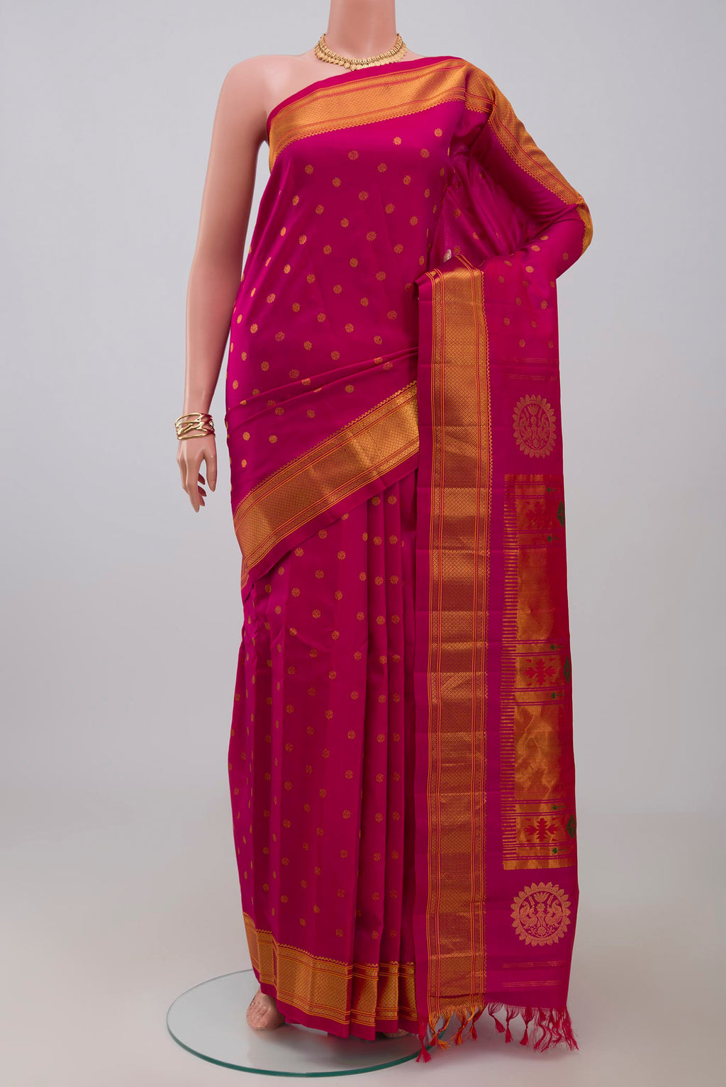 Pink Gadwal Silk Saree with Zari Butta on the body and Zari Border.  displayed on a mannequin