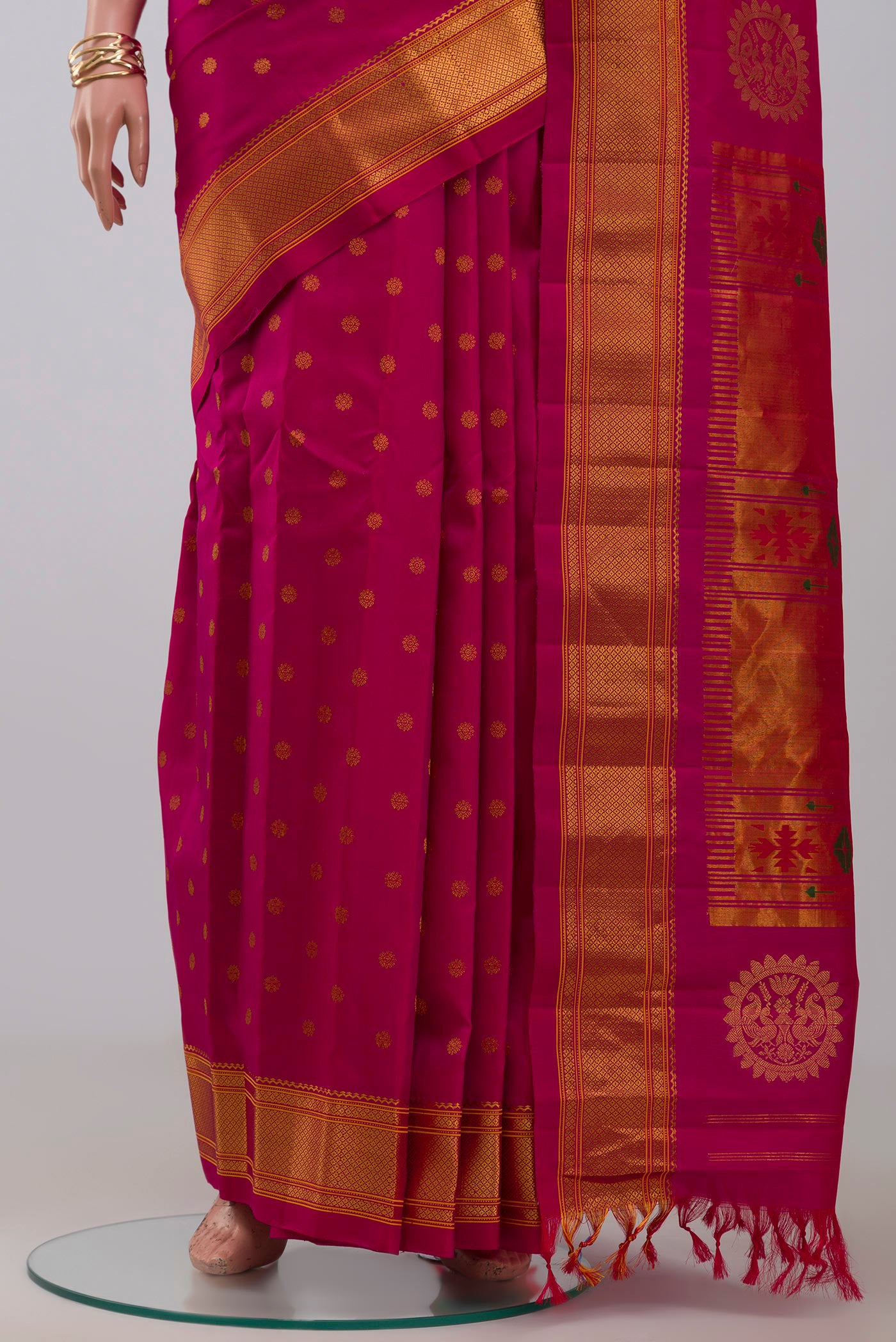 Pleats and pallu of Pink Gadwal Silk Saree with Zari Butta on the body and Zari Border. 