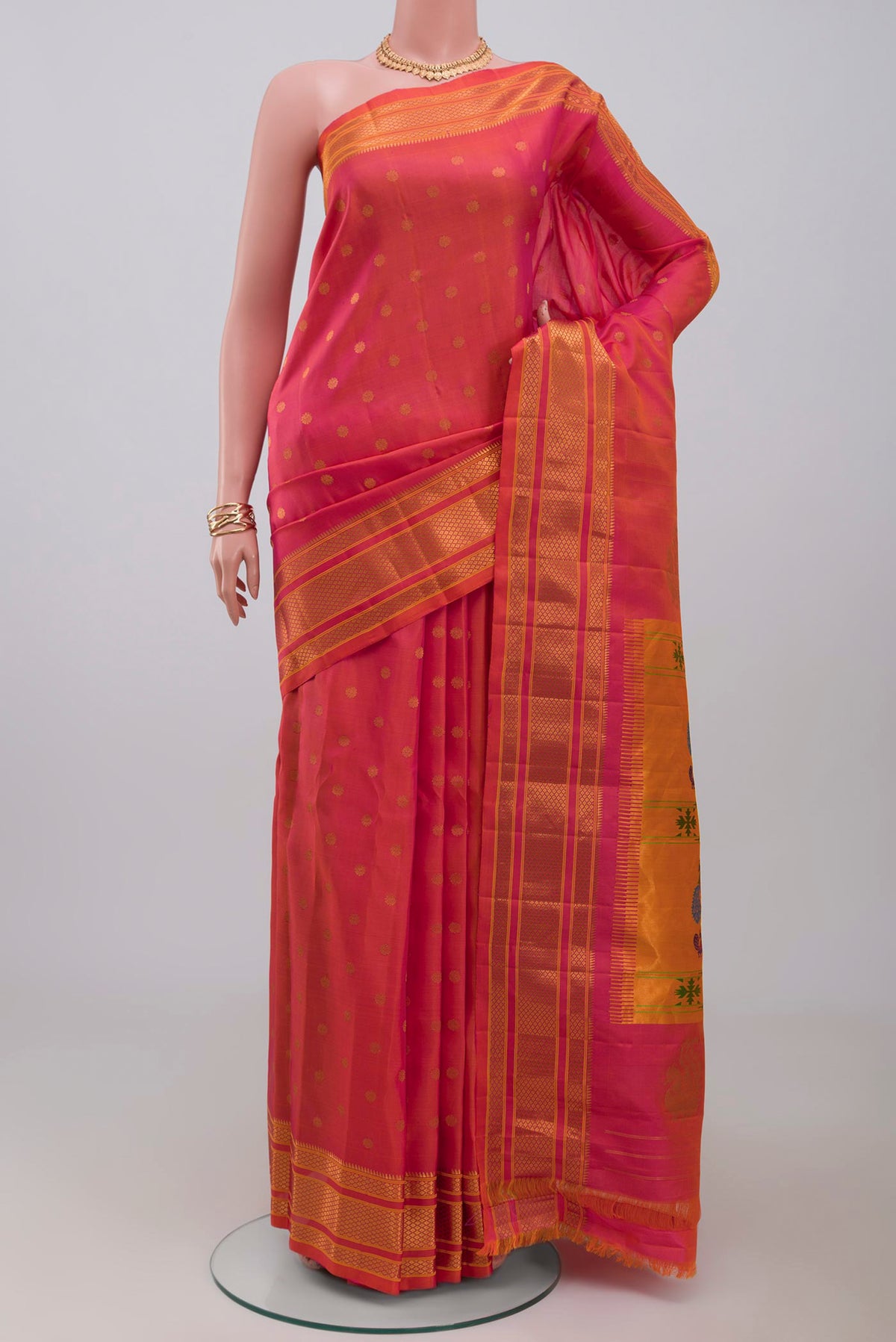 Orange Dual Tone Gadwal Silk Saree with Zari Butta on the body and Zari Border.  displayed on a mannequin