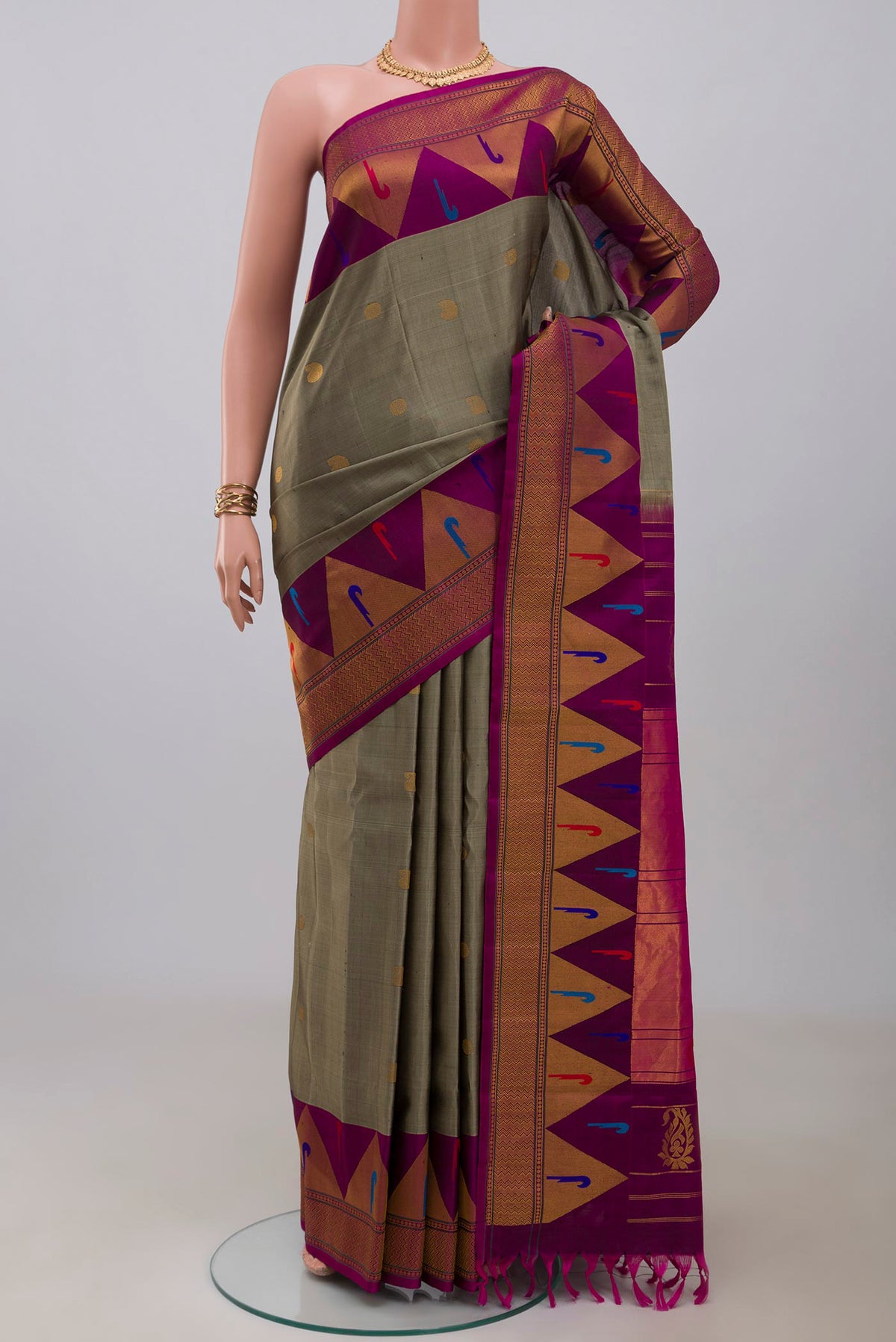 Grey Gadwal Silk Saree with Zari Butta on the body and Fancy Border.  displayed on a mannequin