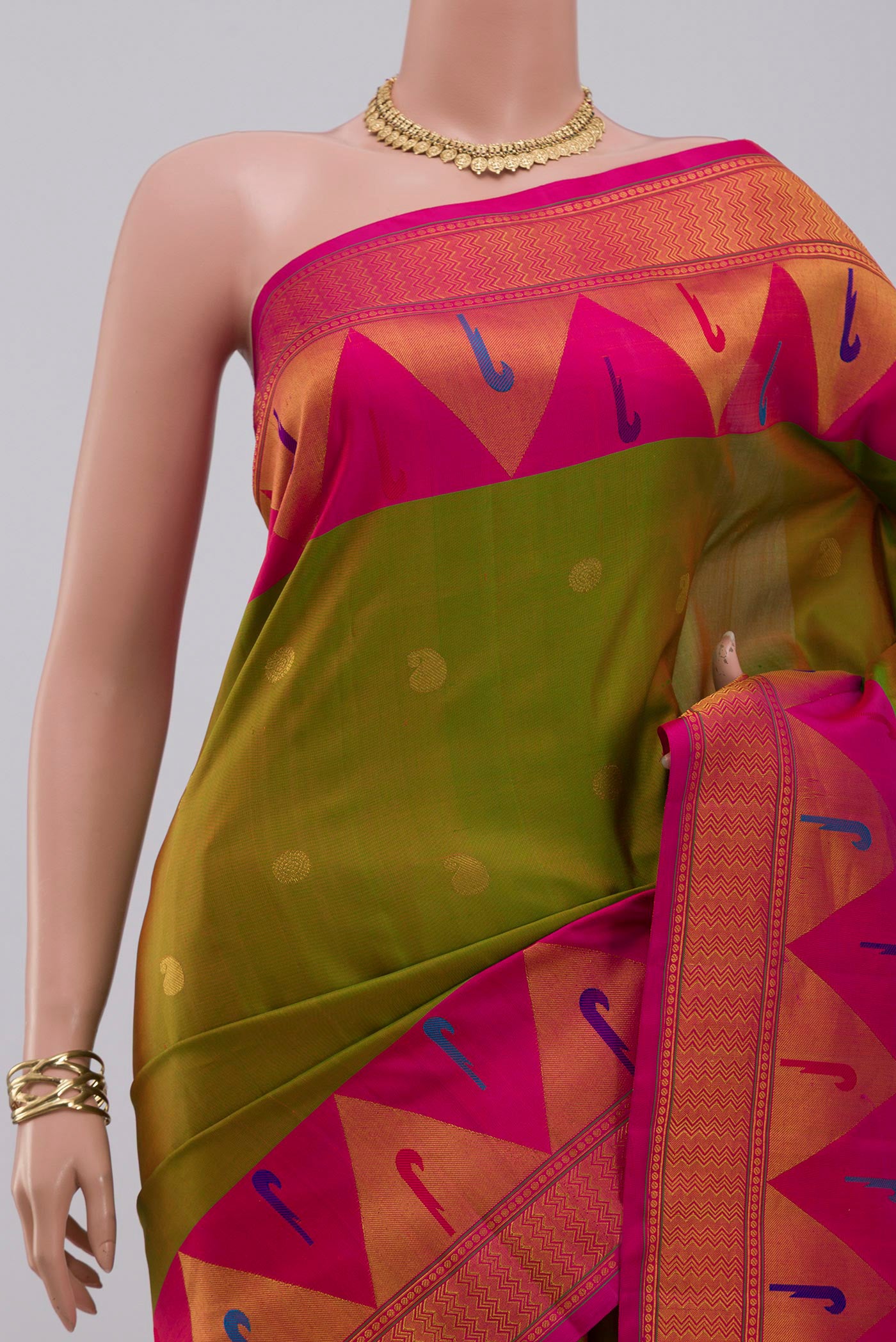 Border image of Green Gadwal Silk Saree with Zari Butta on the body and Paithani Border. 