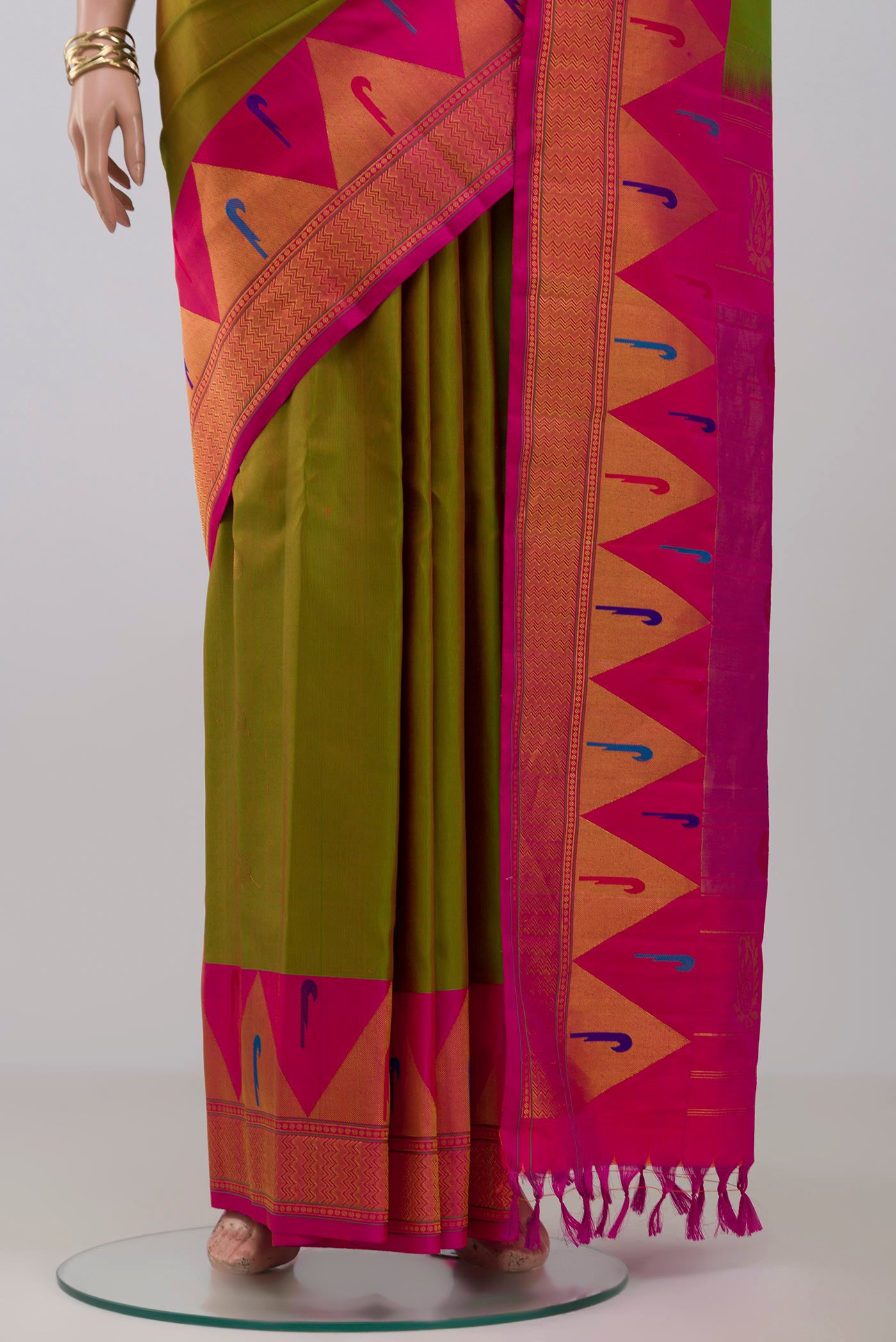 Pleats and pallu of Green Gadwal Silk Saree with Zari Butta on the body and Paithani Border. 