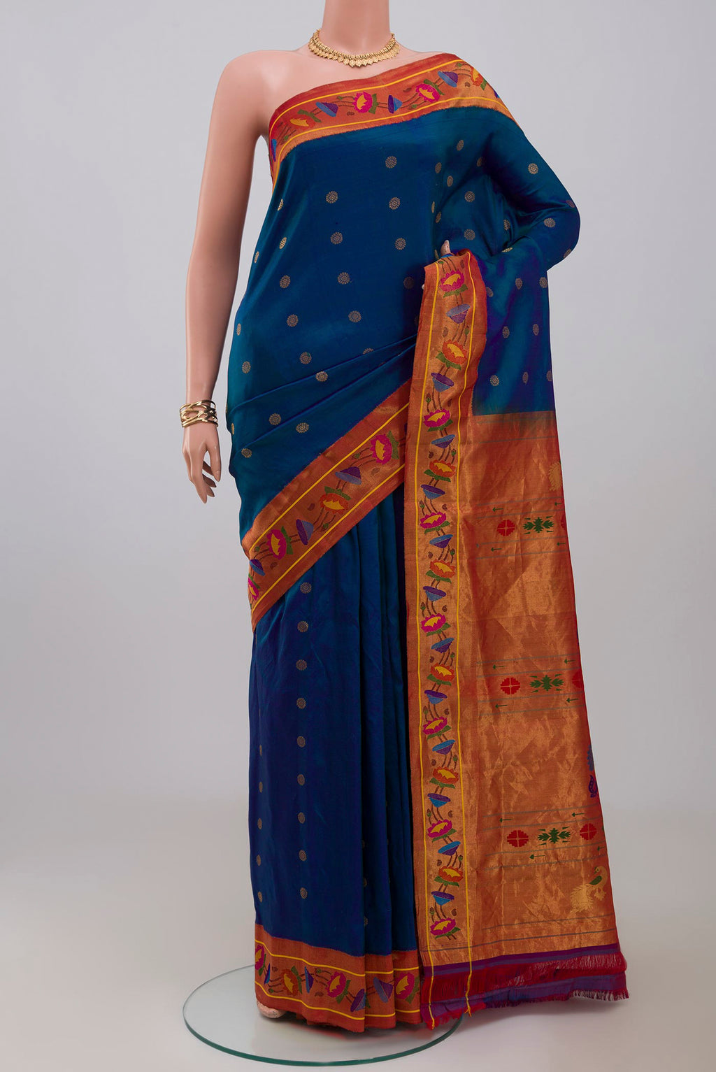 Blue Gadwal Silk Saree with Zari Butta on the body and Paithani Border.  displayed on a mannequin