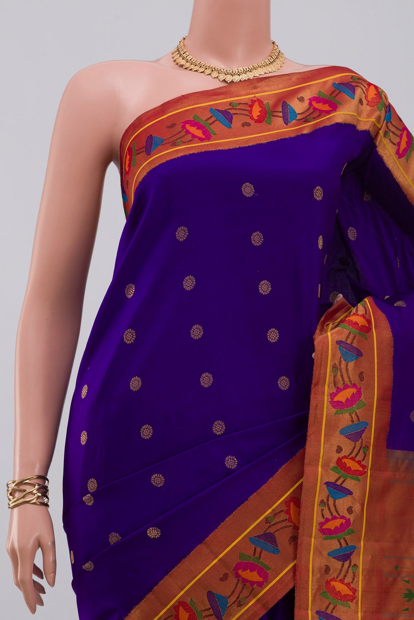 Border image of Blue Gadwal Silk Saree with Zari Butta on the body and Paithani Border. 