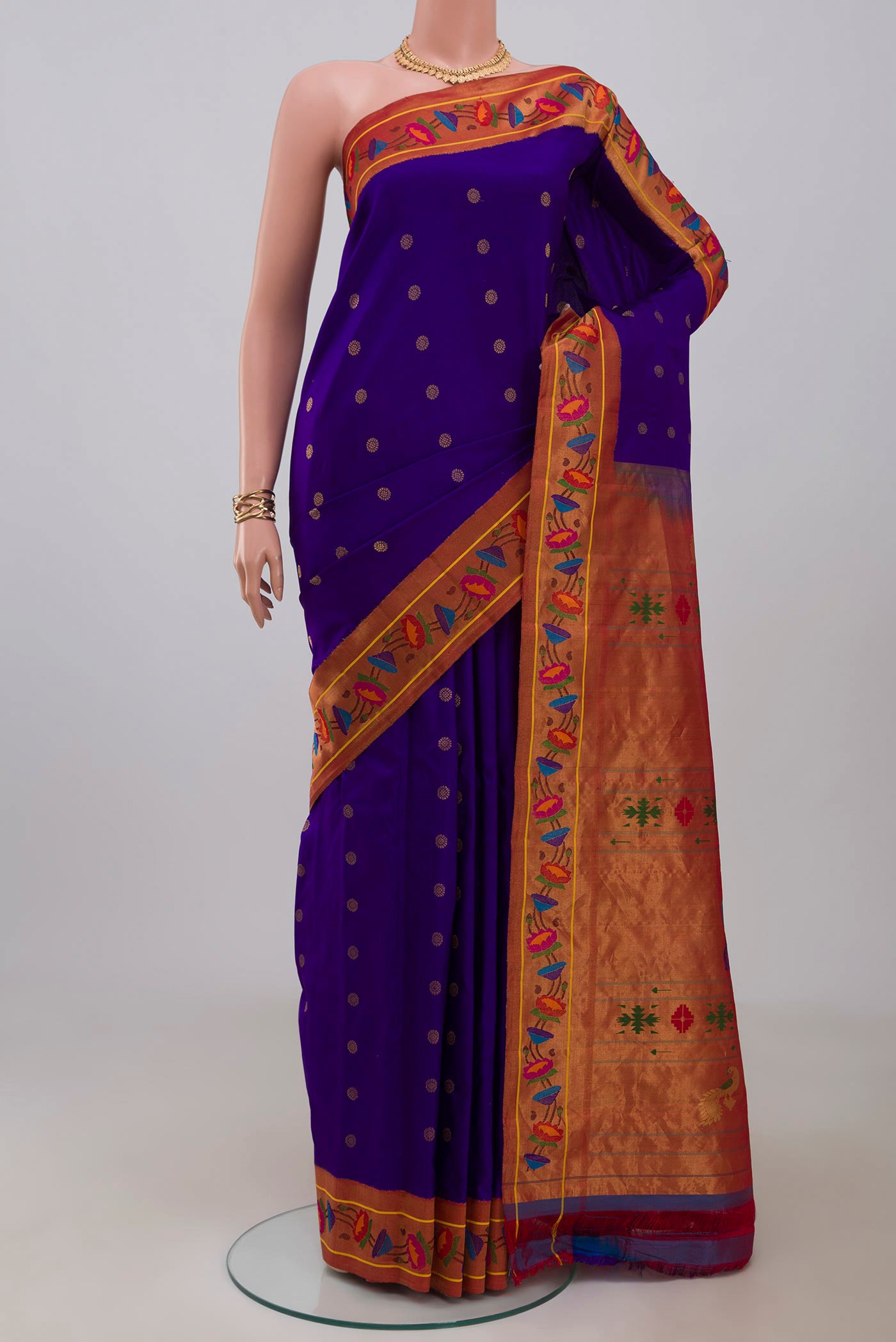 Blue Gadwal Silk Saree with Zari Butta on the body and Paithani Border.  displayed on a mannequin