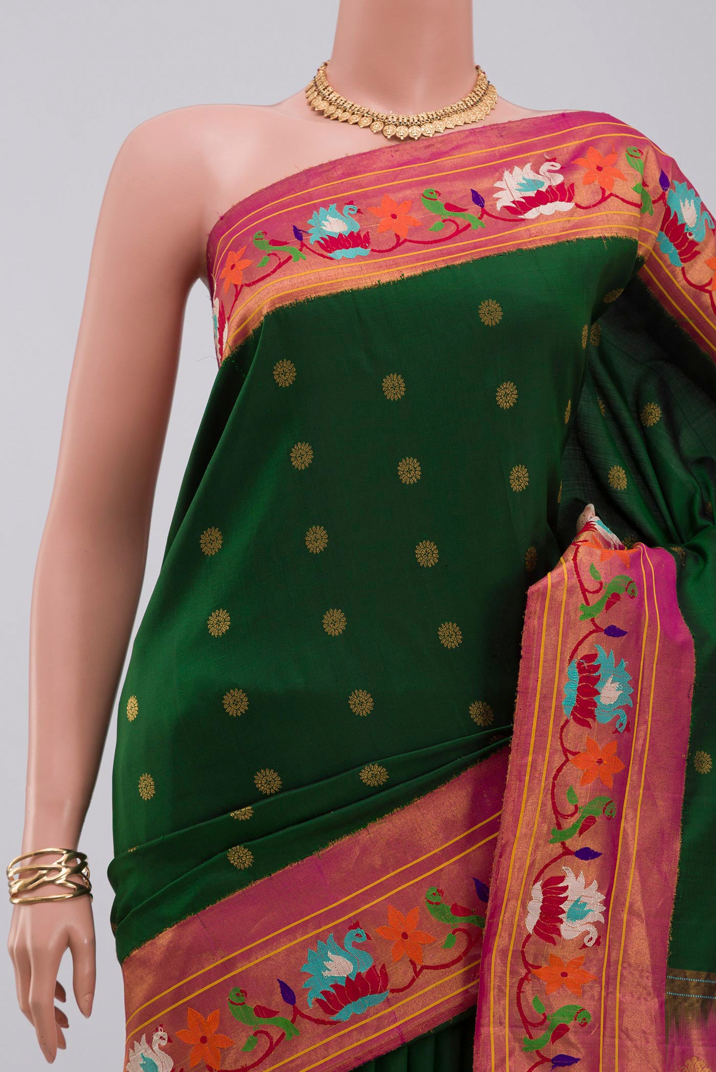 Border image of Green Gadwal Silk Saree with Zari Butta on the body and Paithani Border. 