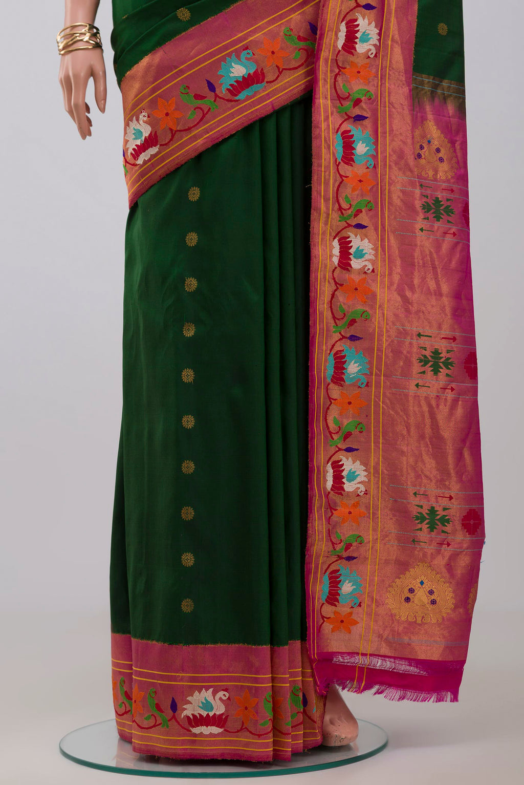 Pleats and pallu of Green Gadwal Silk Saree with Zari Butta on the body and Paithani Border. 