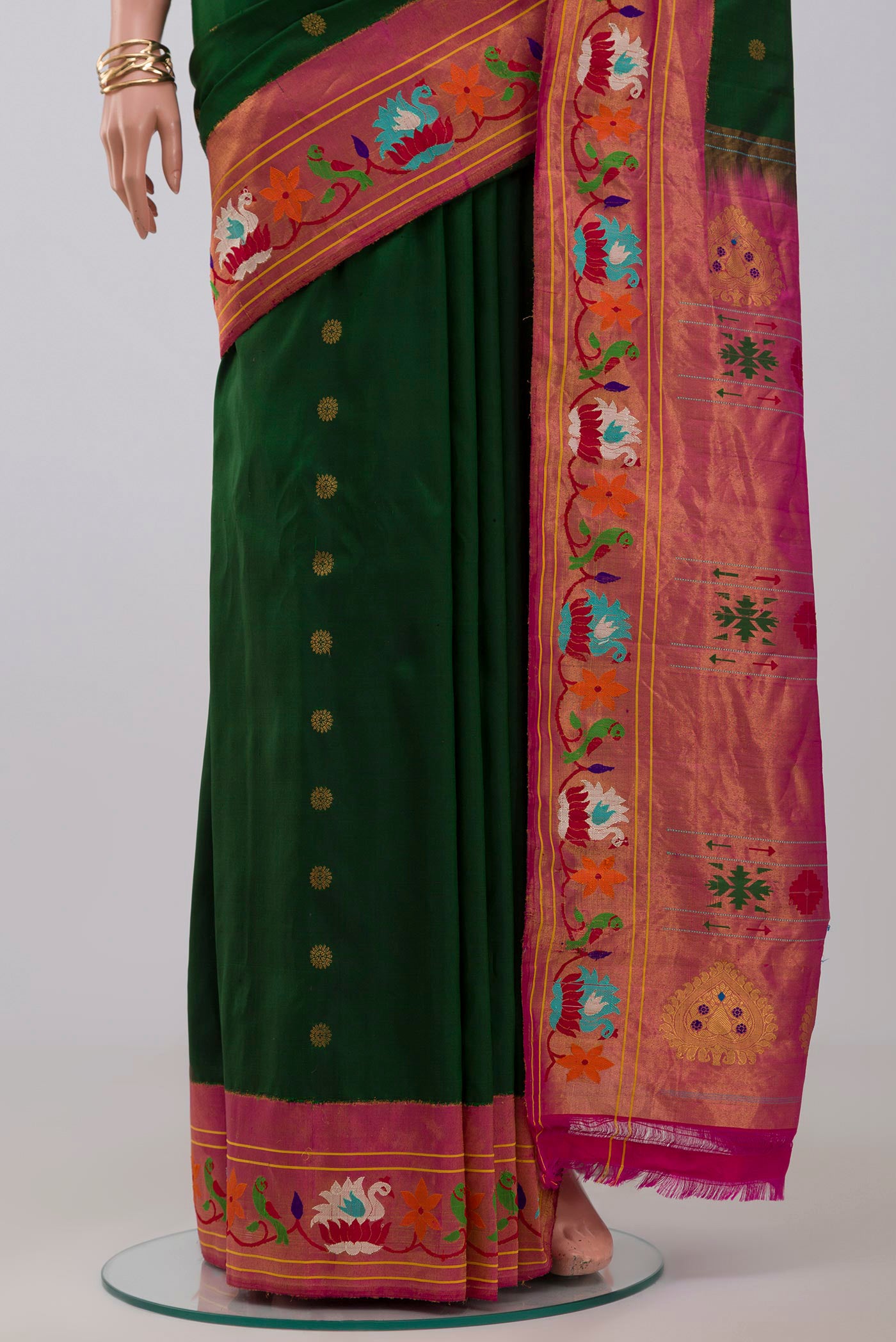 Pleats and pallu of Green Gadwal Silk Saree with Zari Butta on the body and Paithani Border. 