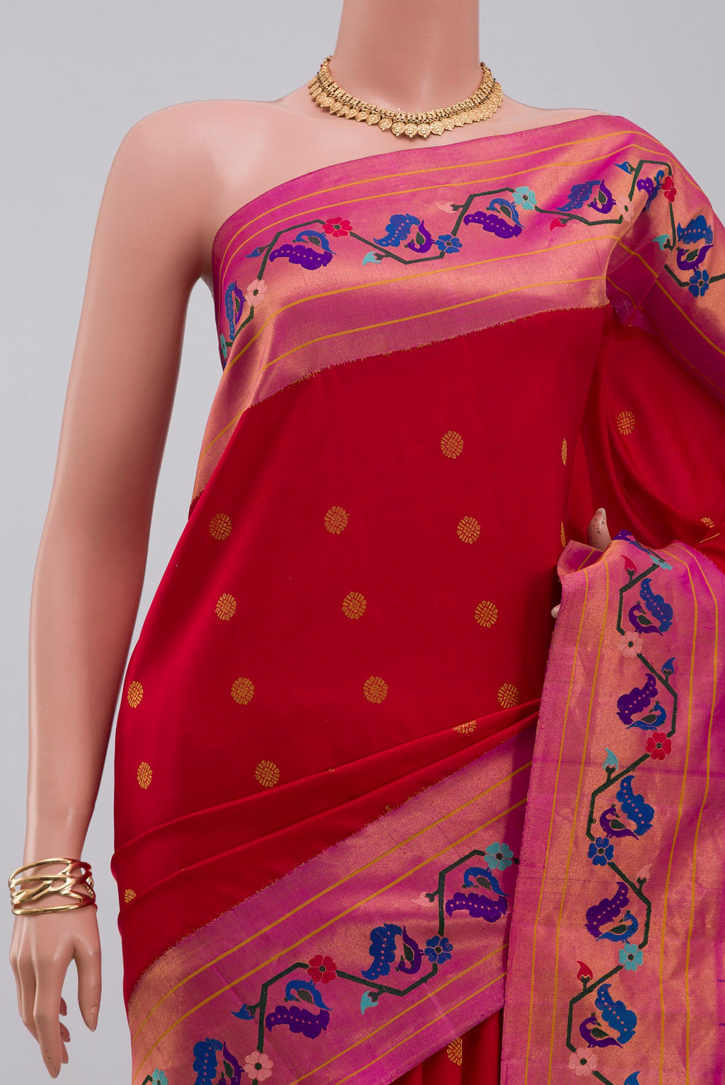 Border image of Red Gadwal Silk Saree with Zari Butta on the body and Paithani Border. 
